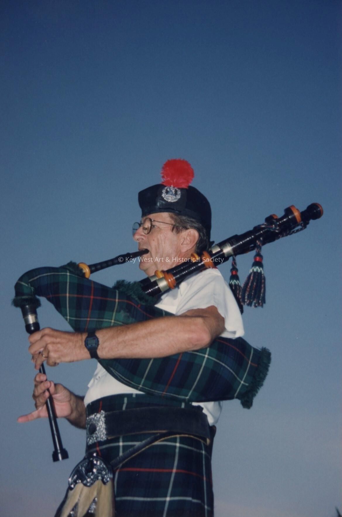 An unknown member of the St. Andrews pipe band playing.