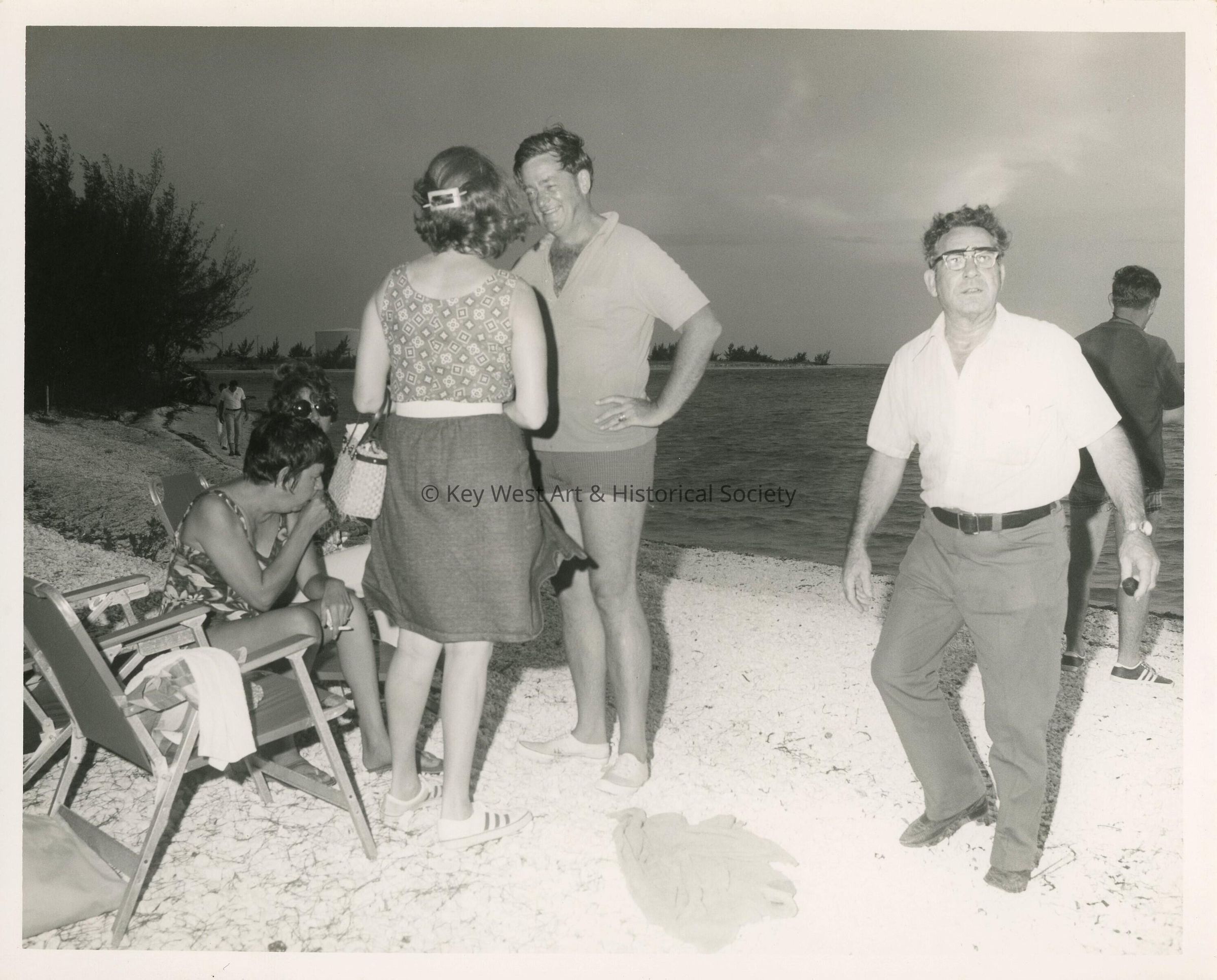 A group of unknown people at the beach