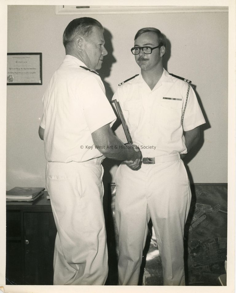 2 Men in uniform shaking hands