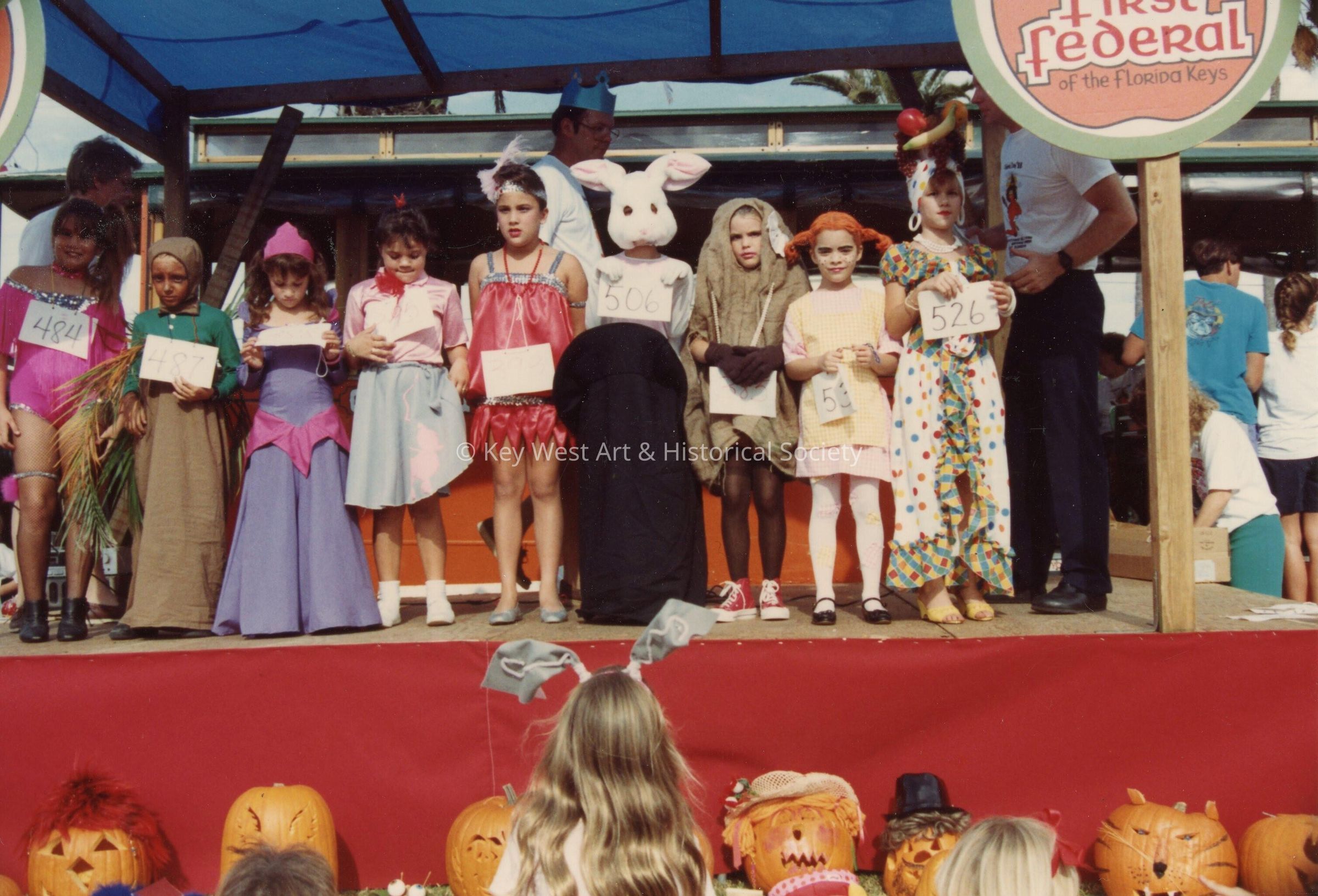 A group of unknown children dressed up at children's day.