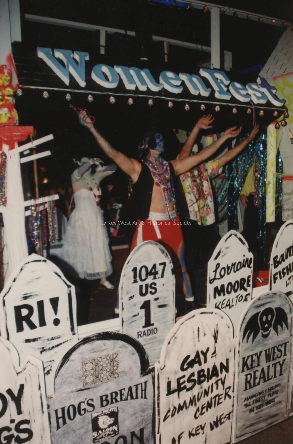 A float in the parade that reads Woman Fest.