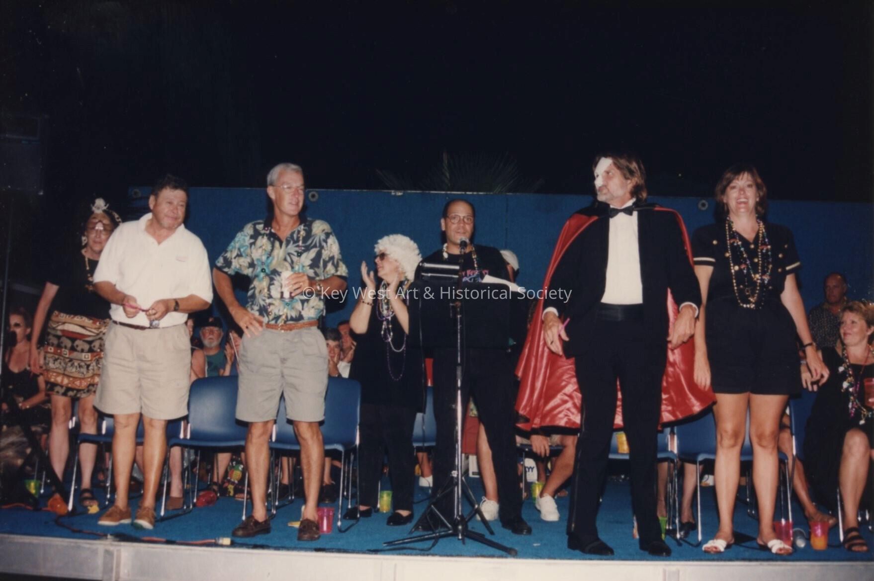 A group of unknown people on the stage.