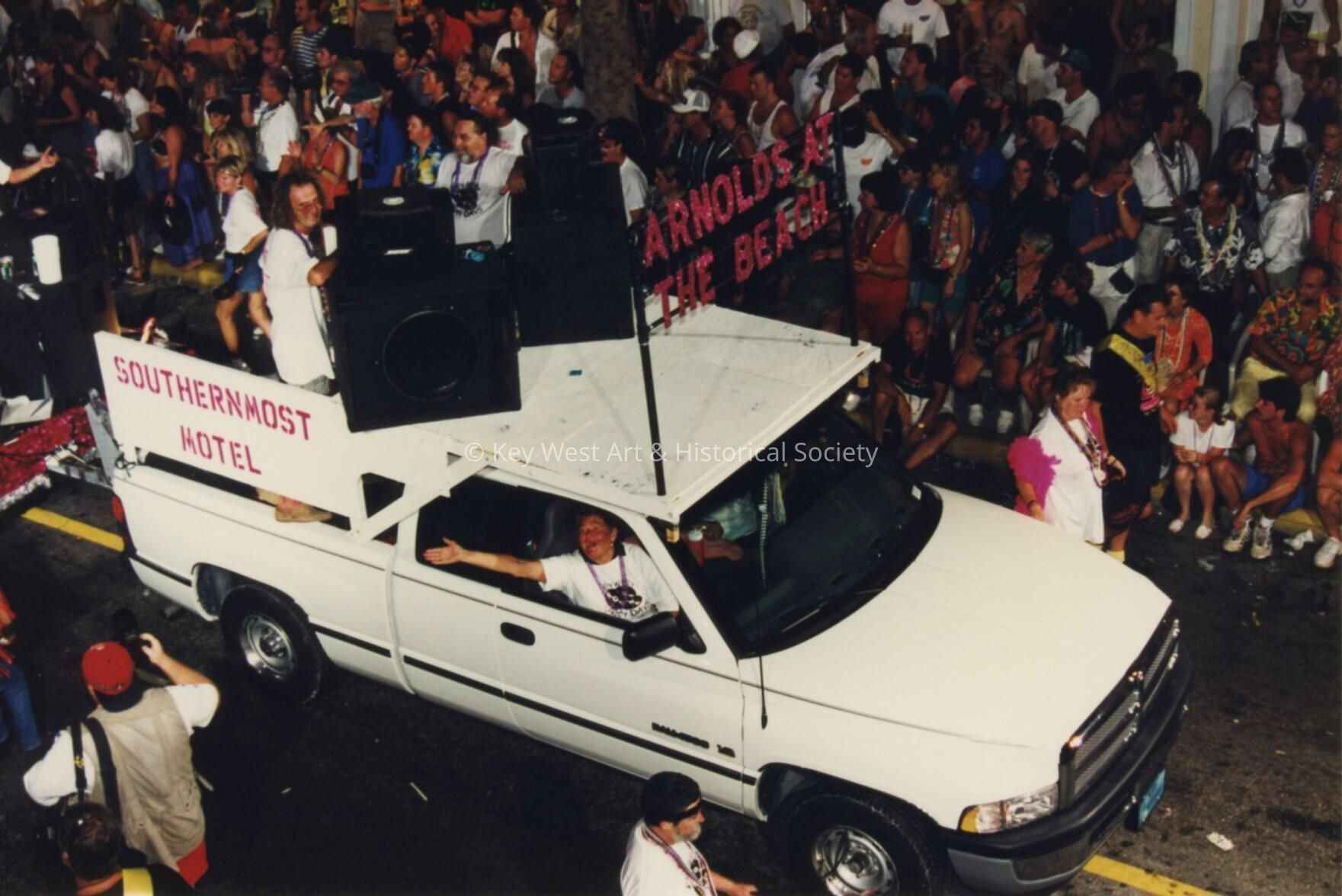 A float in the parade that reads Arnolds at the beach.