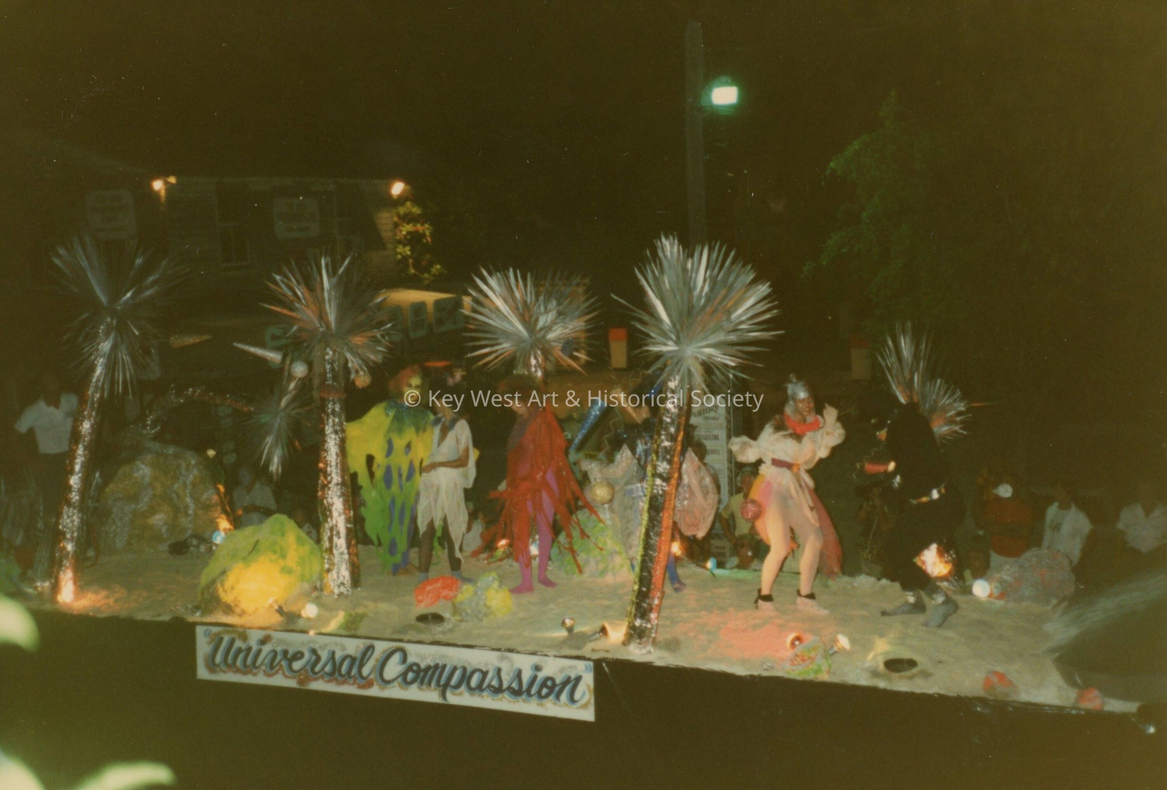 A float in the parade that reads Universal Compassion.