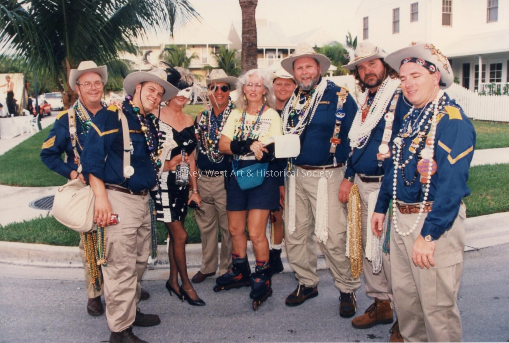 A group of unknown people dressed up.