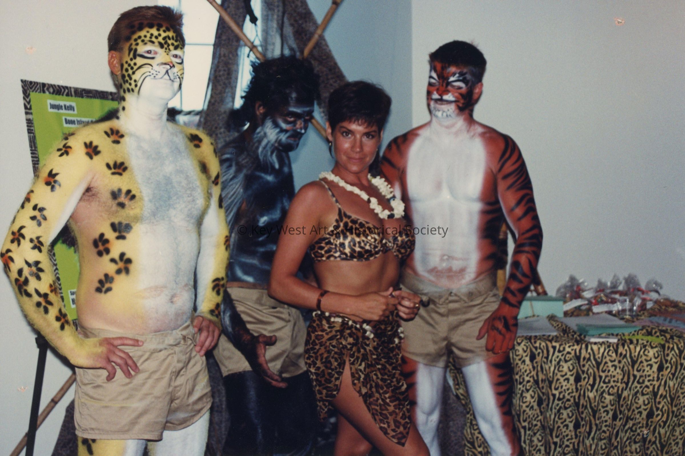 4 unknown people dressed up.