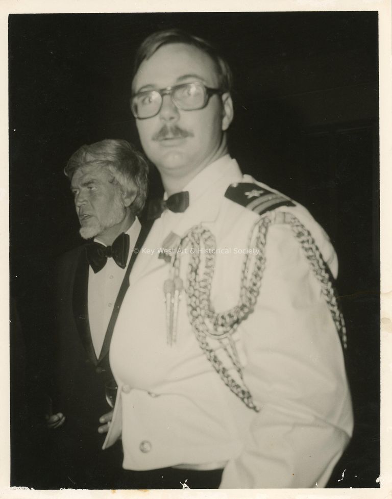 2 Unknown men at a ceremony