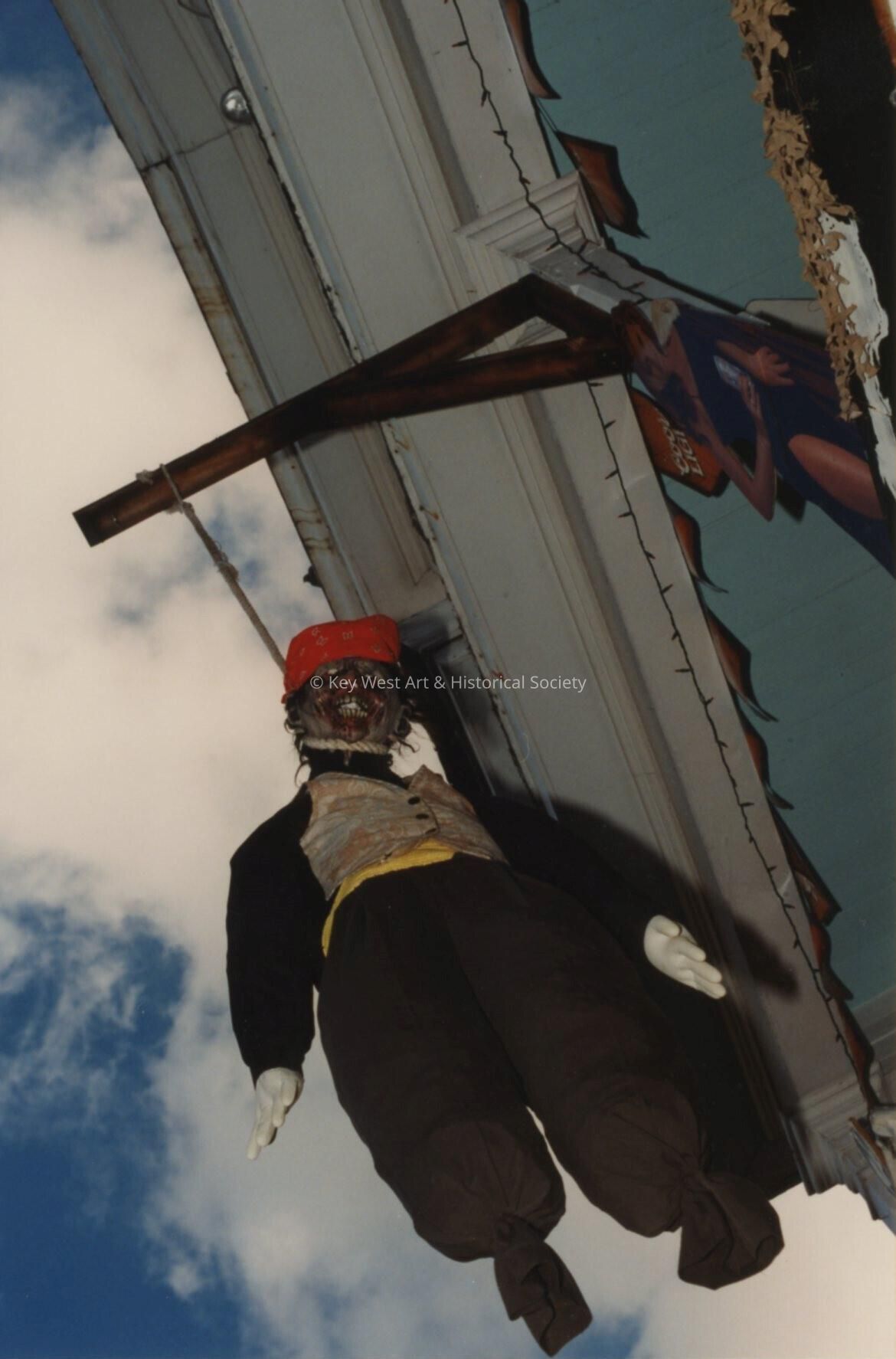 A doll hanging from the roof.