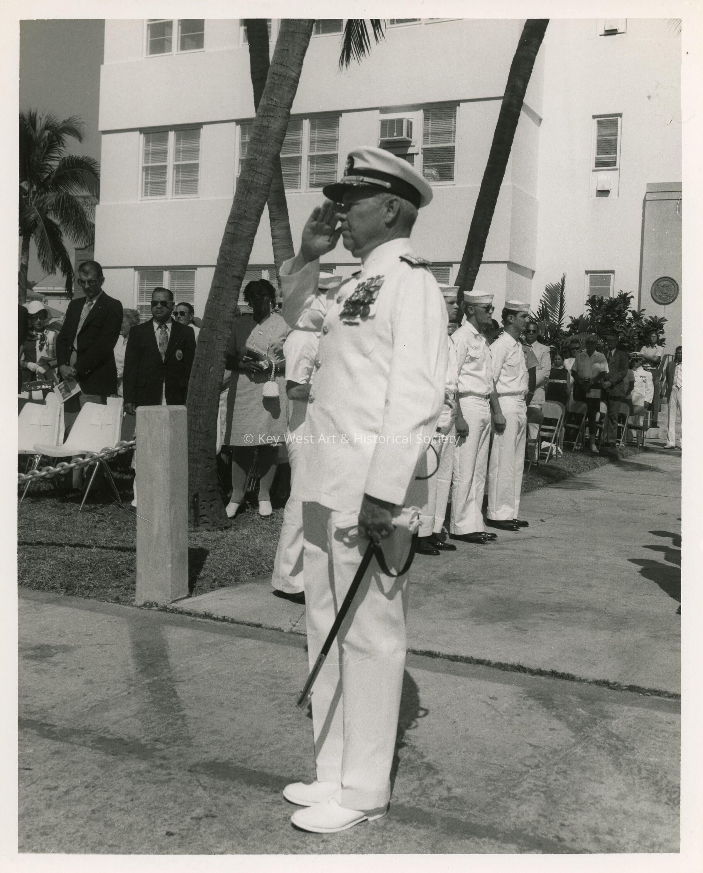 A man in uniform saluting