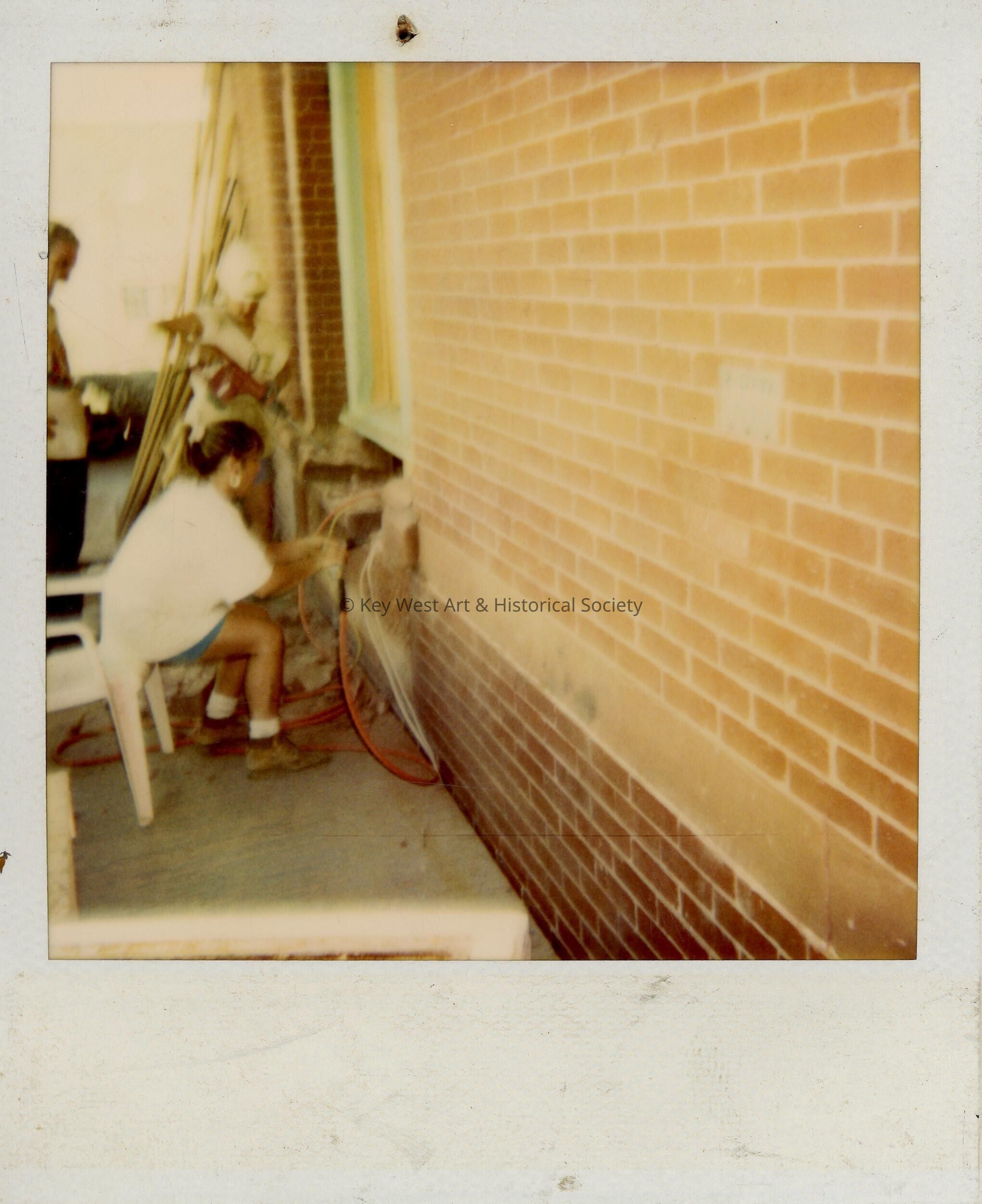 An woman working on the exterior.