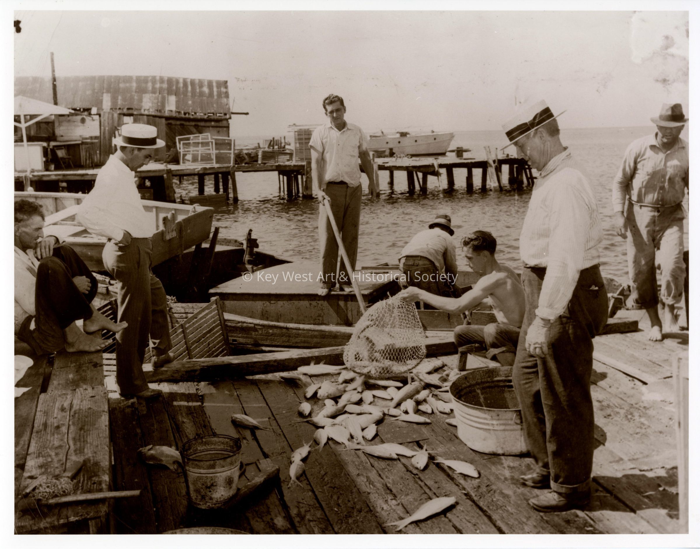 Fishermen Unloading Yellowtail Snapper; © Key West Art & Historical Society