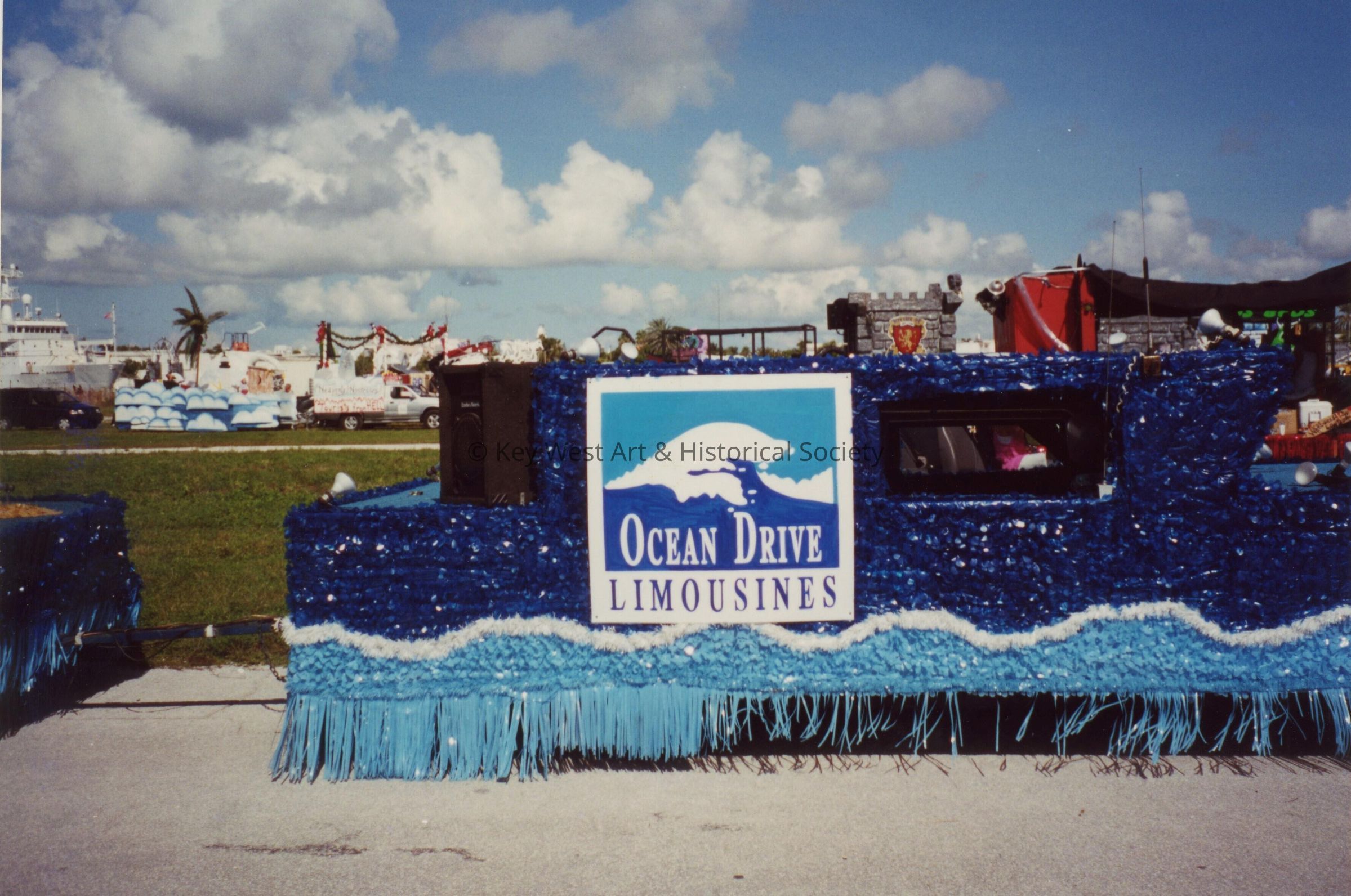 A float in the parade that reads Ocean Drive limousines.