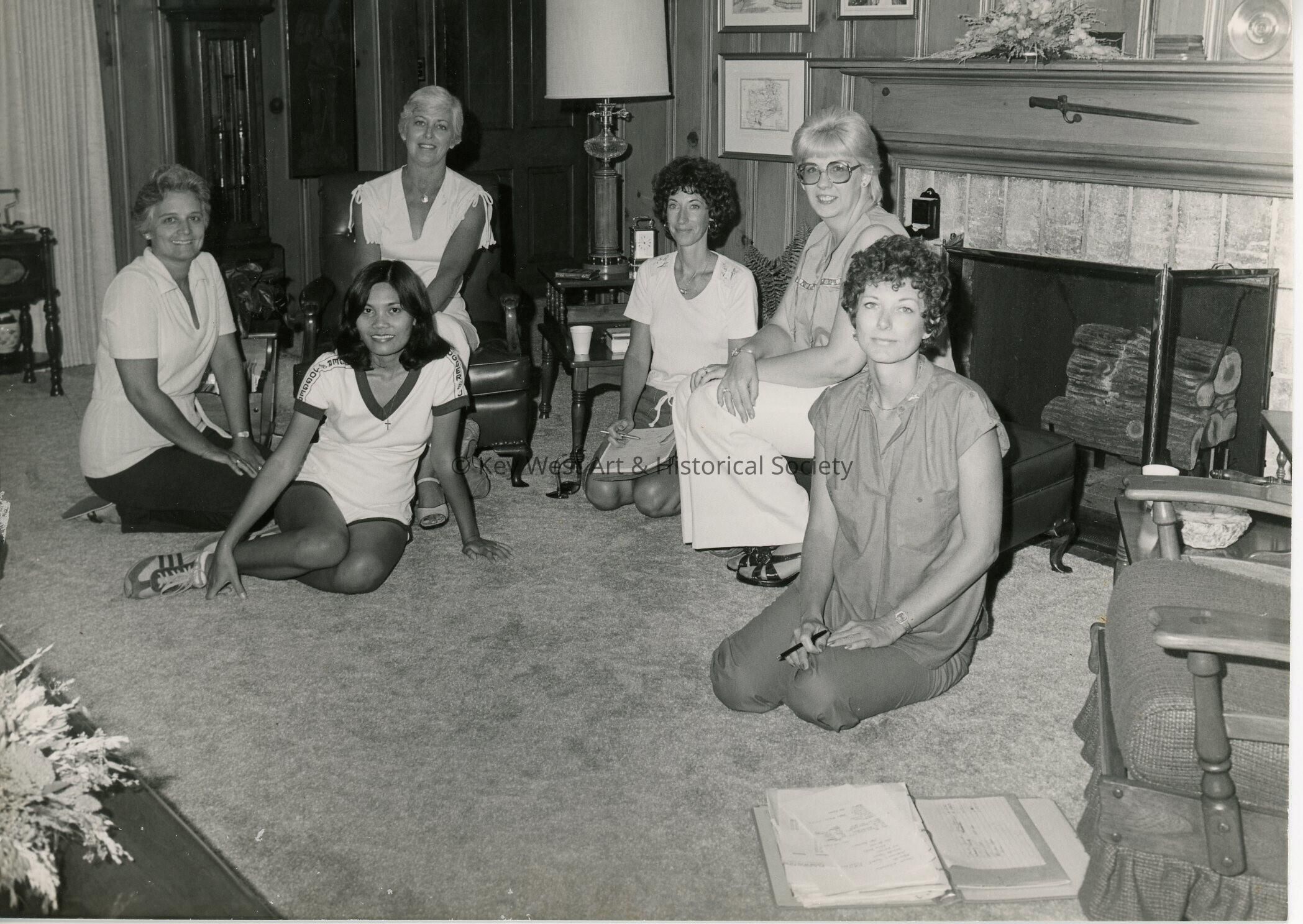 A group of ladies sitting in a living room