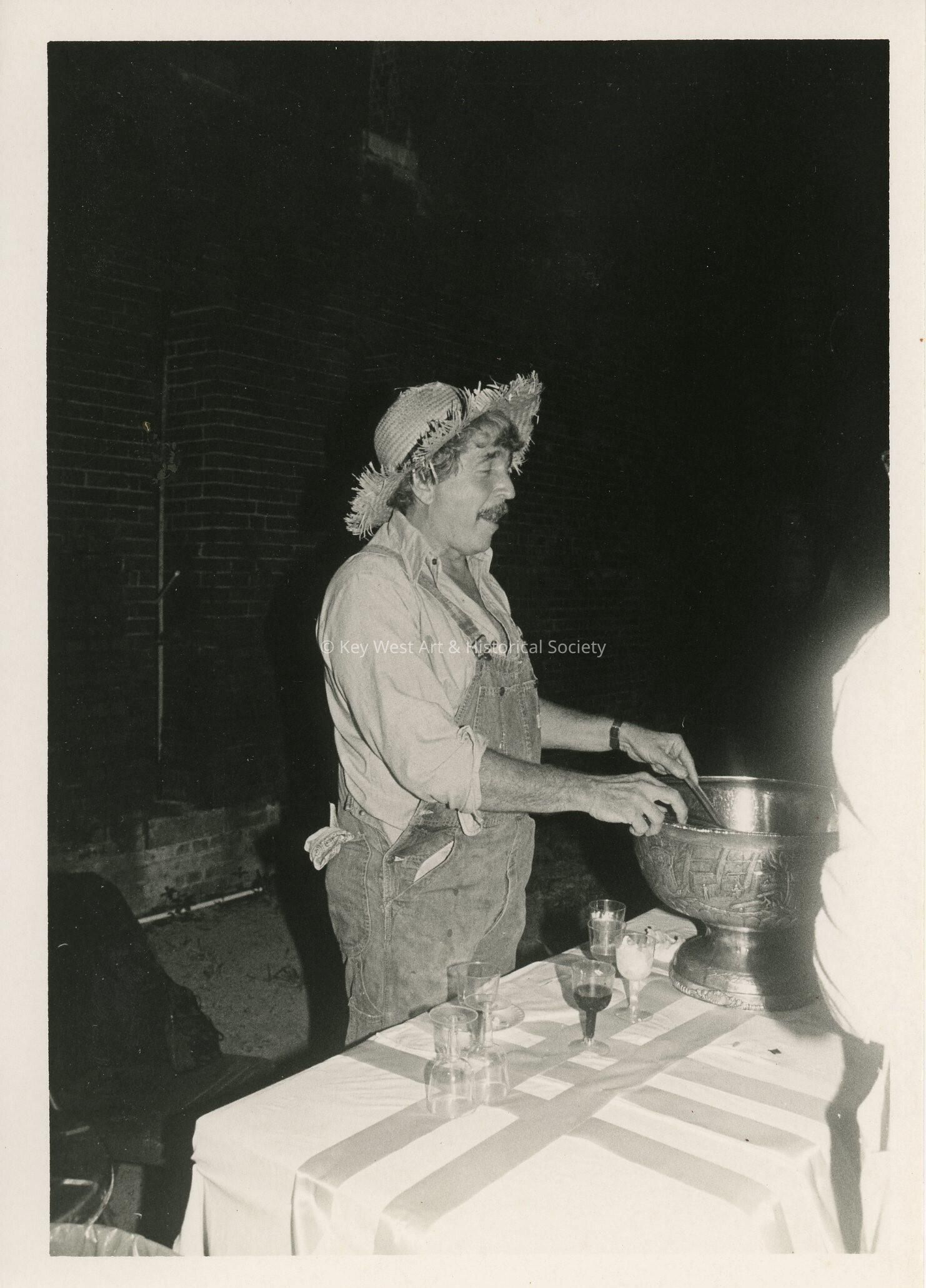An unknown man dressed up as a scare crow
