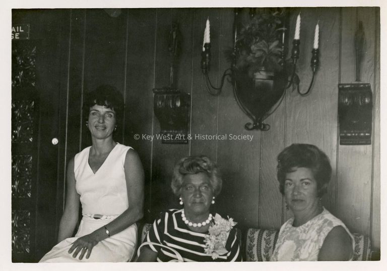 3 Unknown woman sitting in a living room