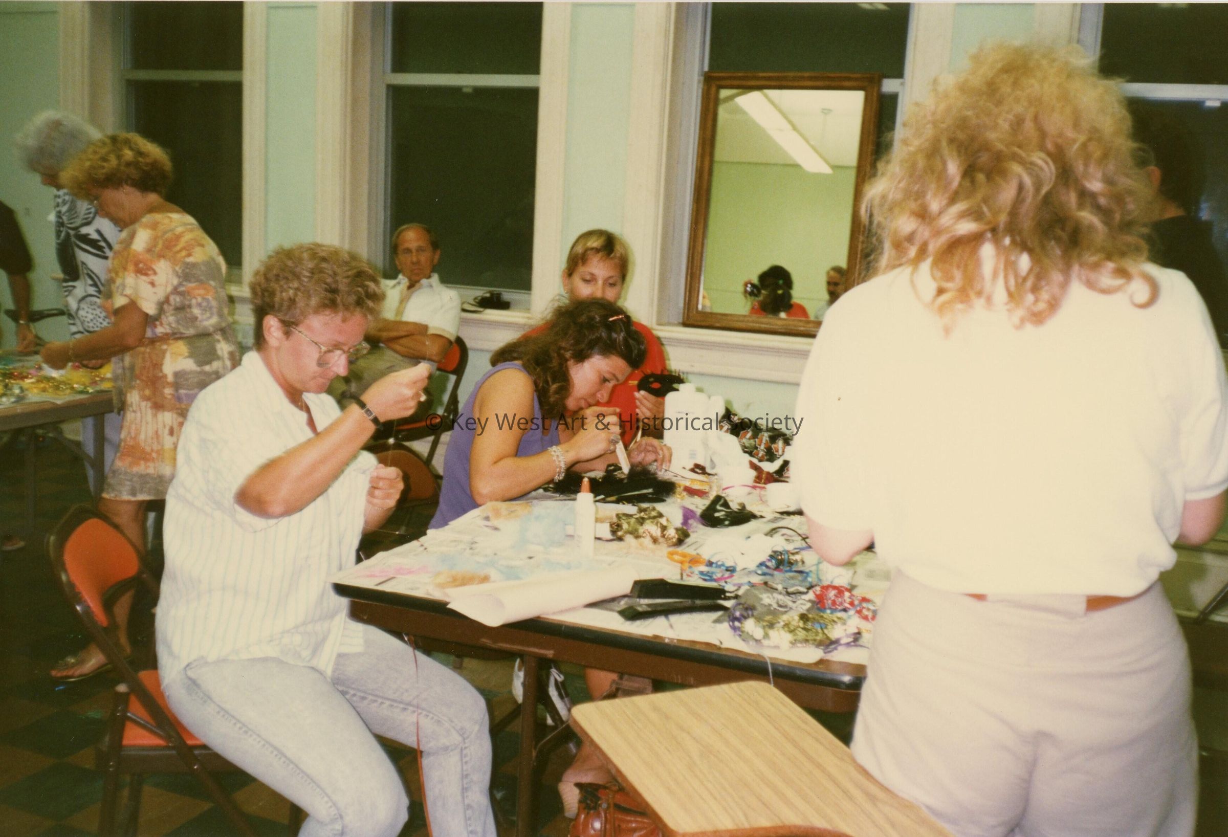 A group of unknown people making face masks.