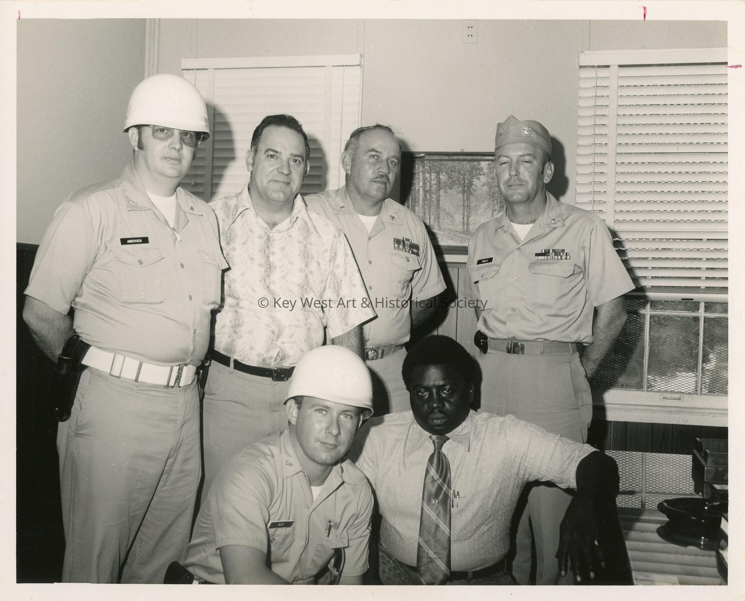 A group of unknown men in an office