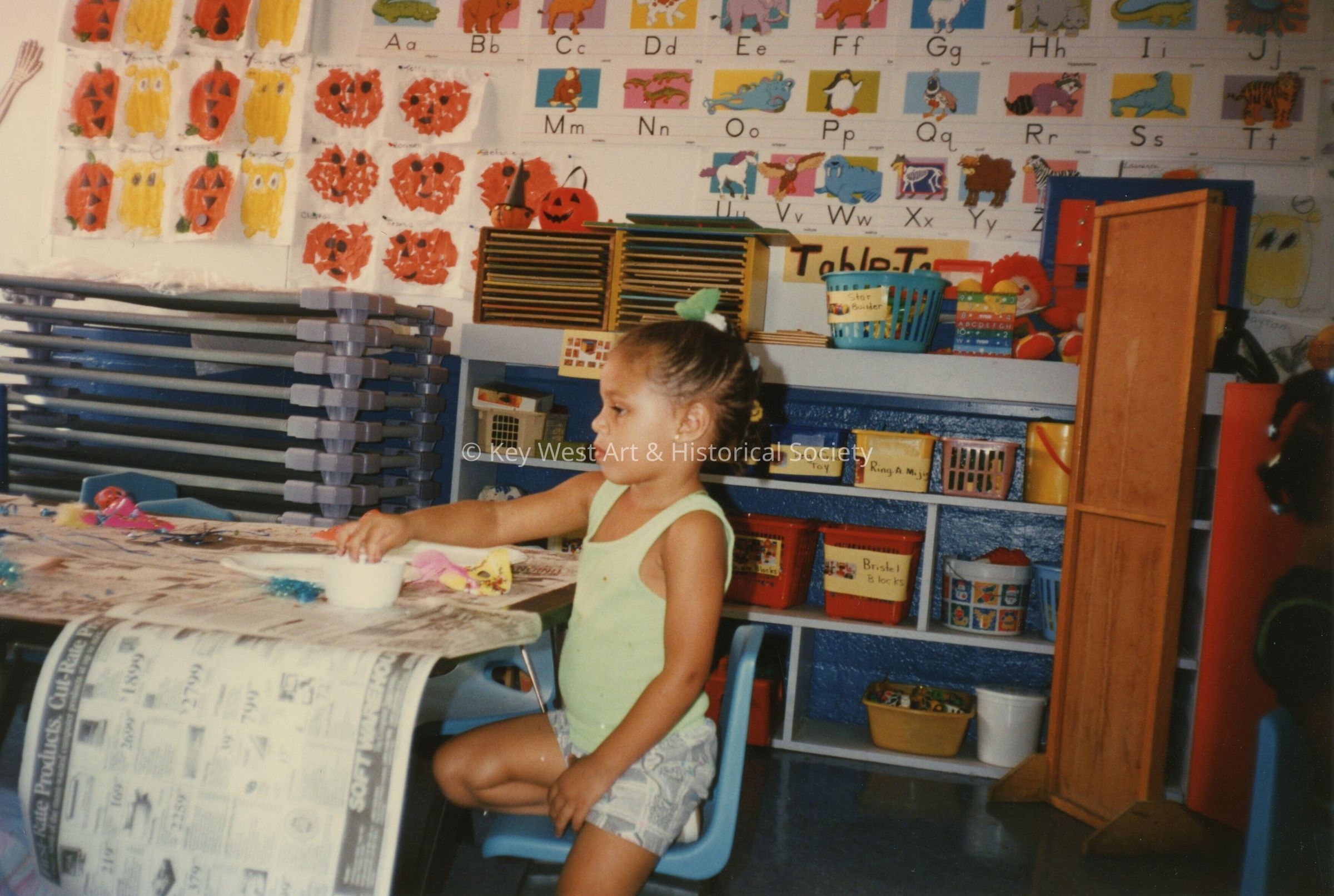 An unknown child in a classroom.