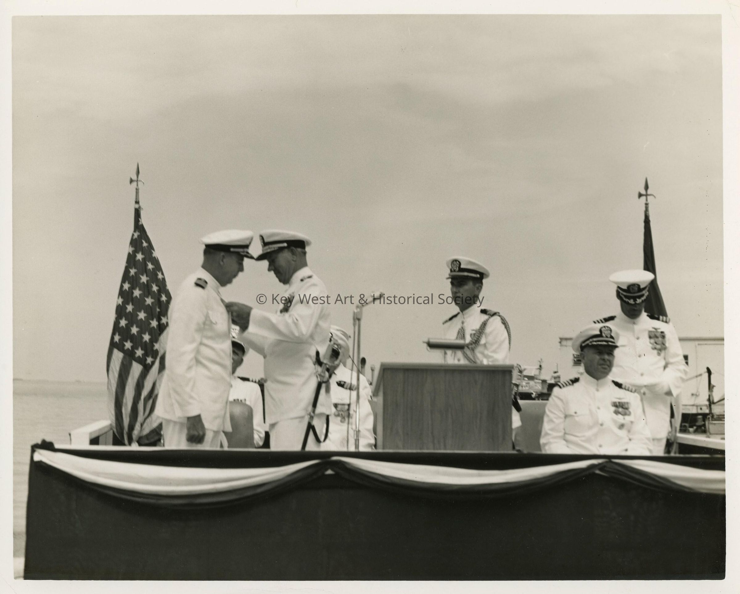An unknown man in uniform receiving a metal