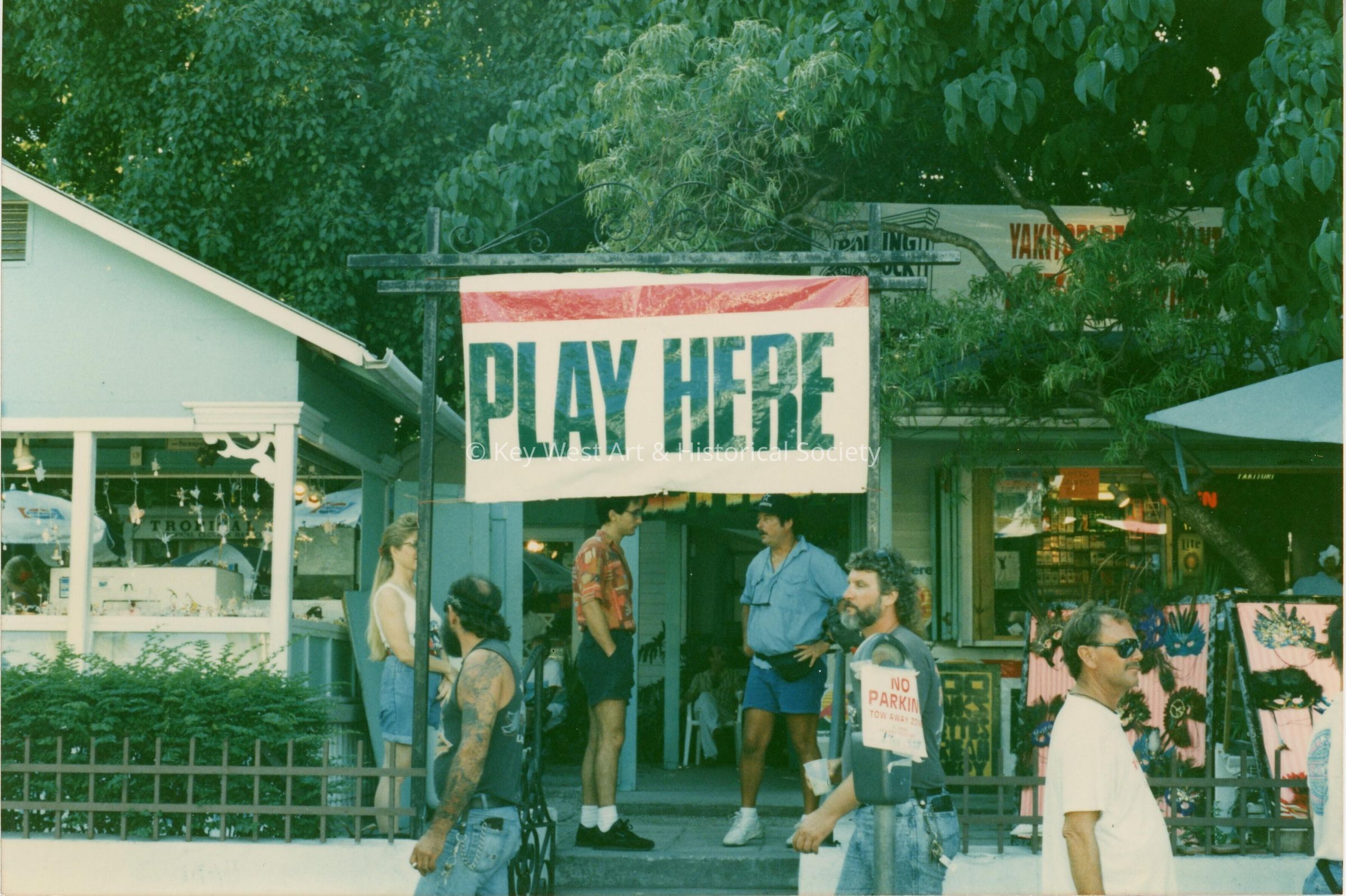 A sign that reads play here.