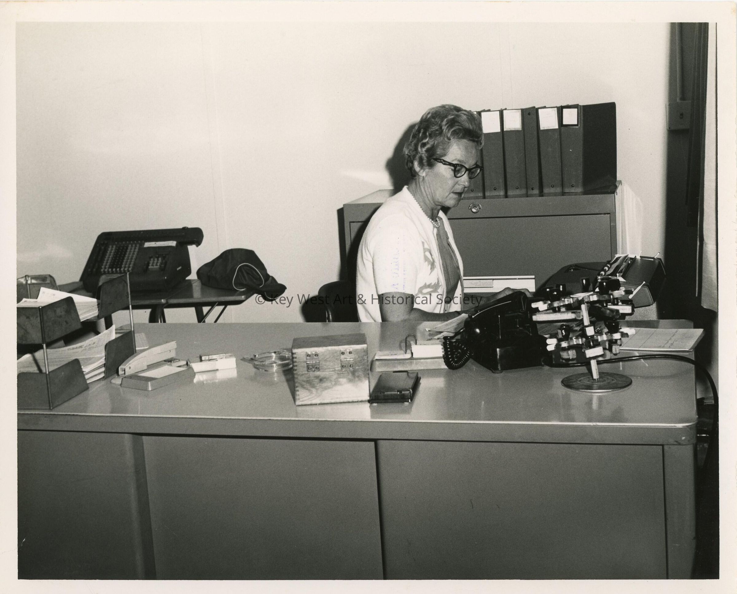 An unknown woman in an office