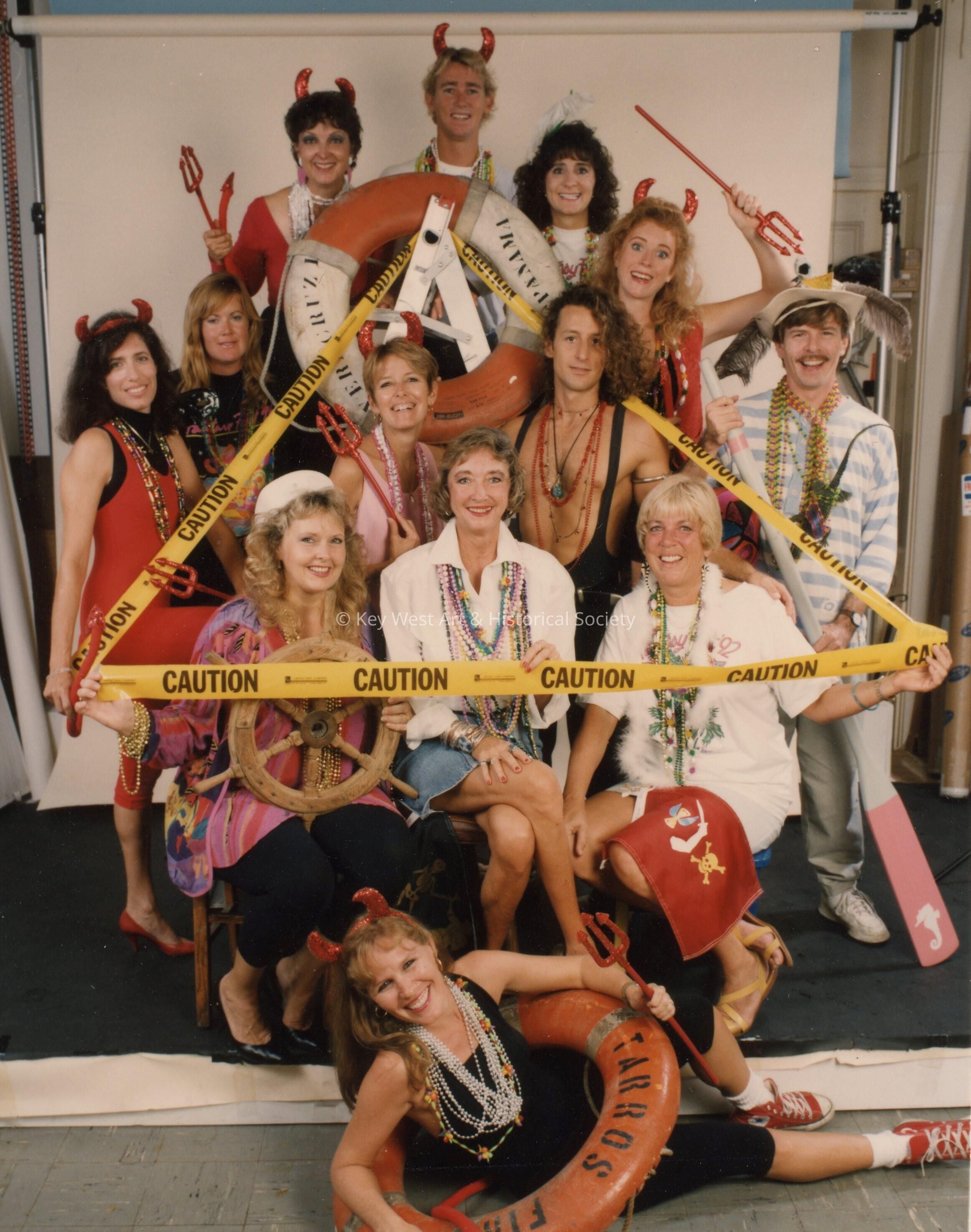 A group of unknown people dressed up.