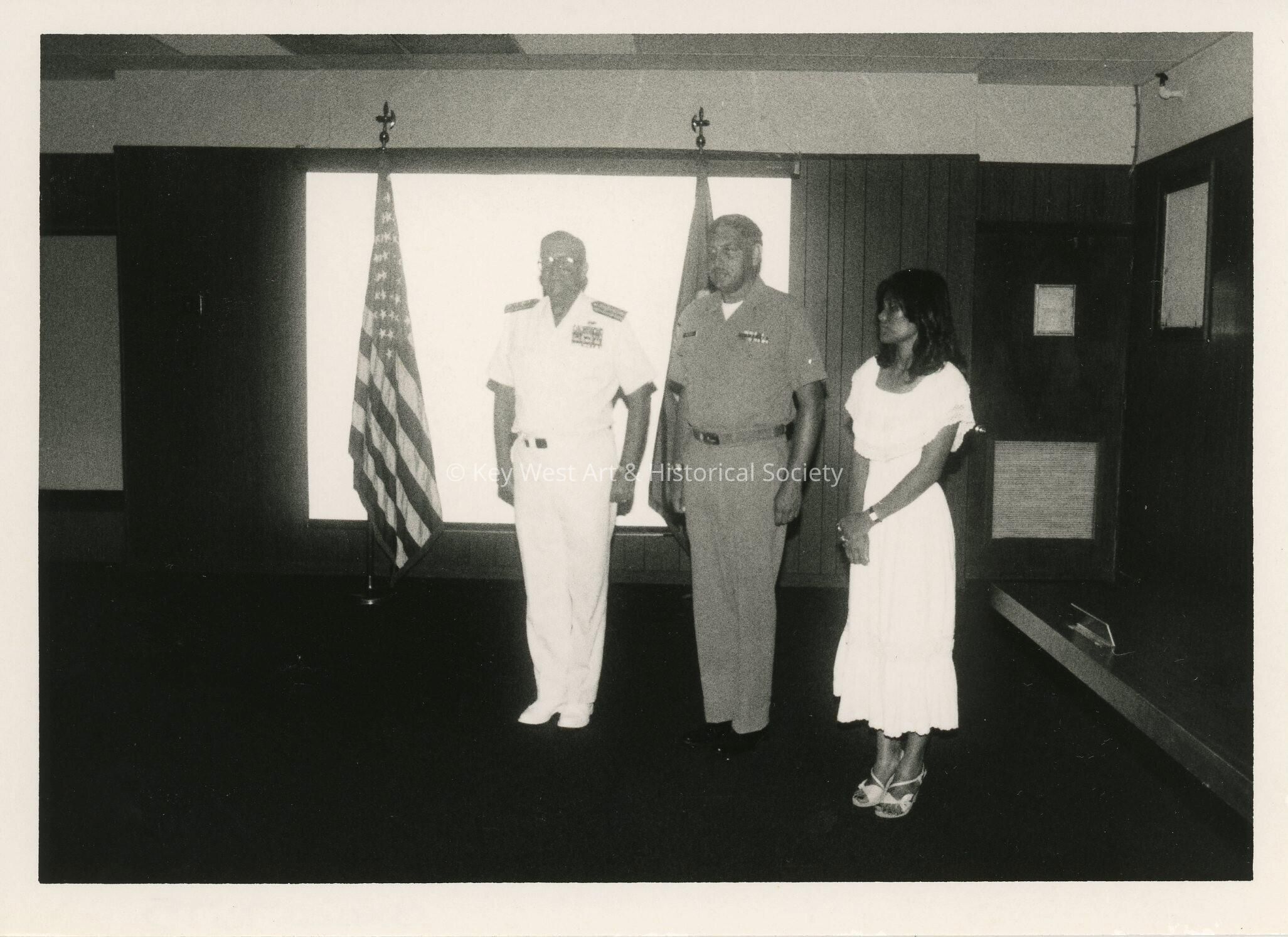 3 Unknown people at a ceremony