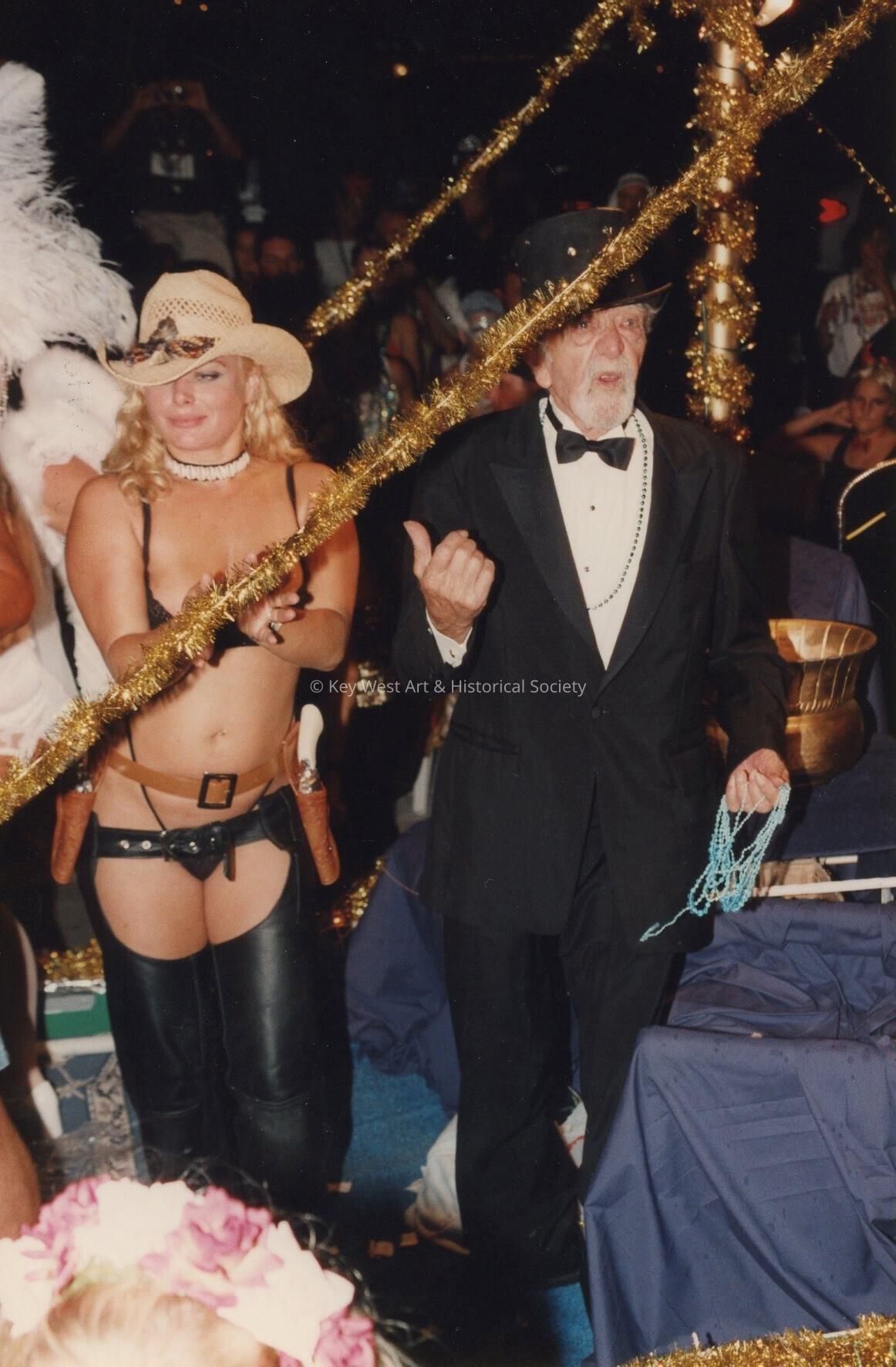 An Unknown woman and Capt. Tony on a float.