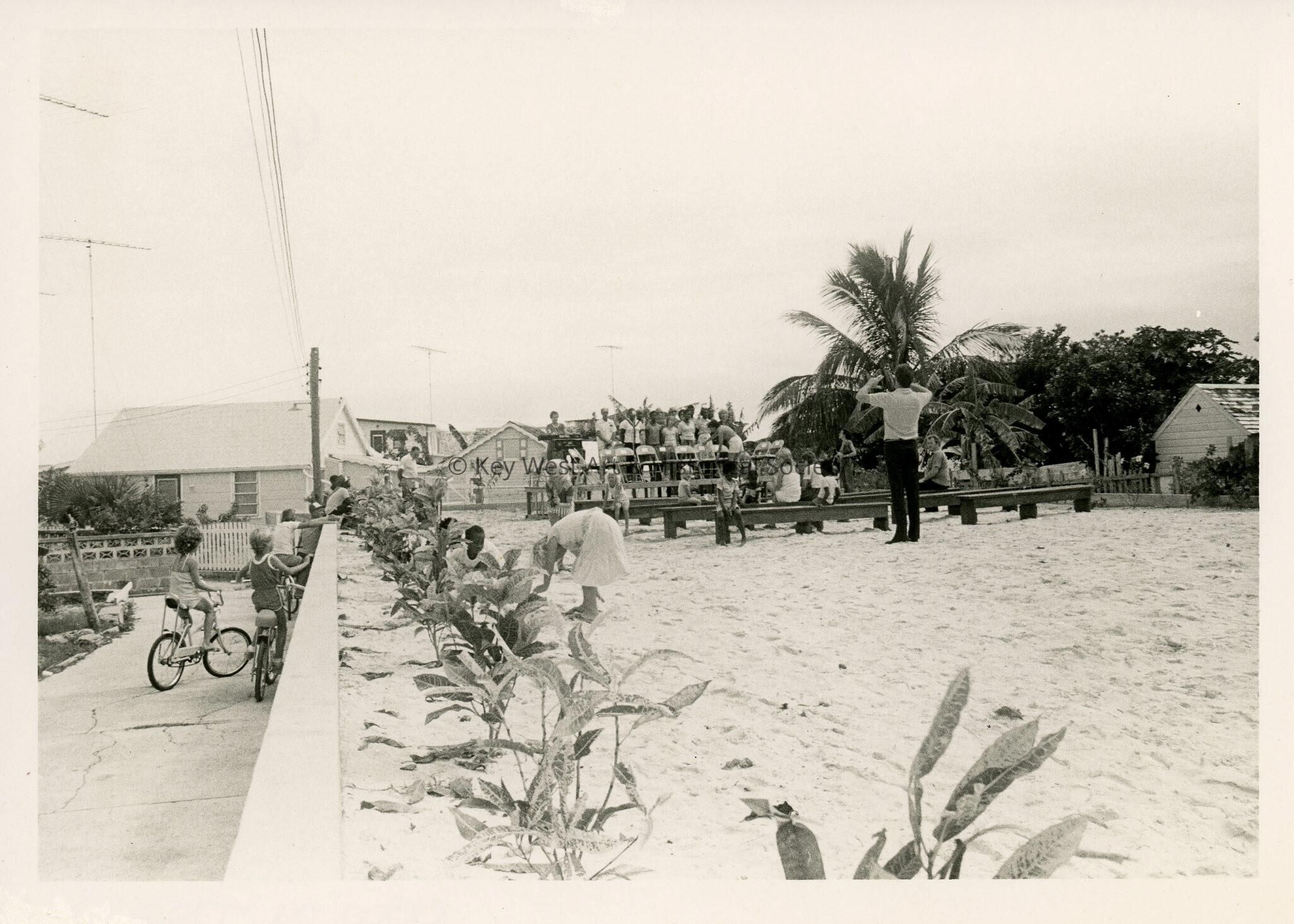 A group of people standing for a picture at the beach