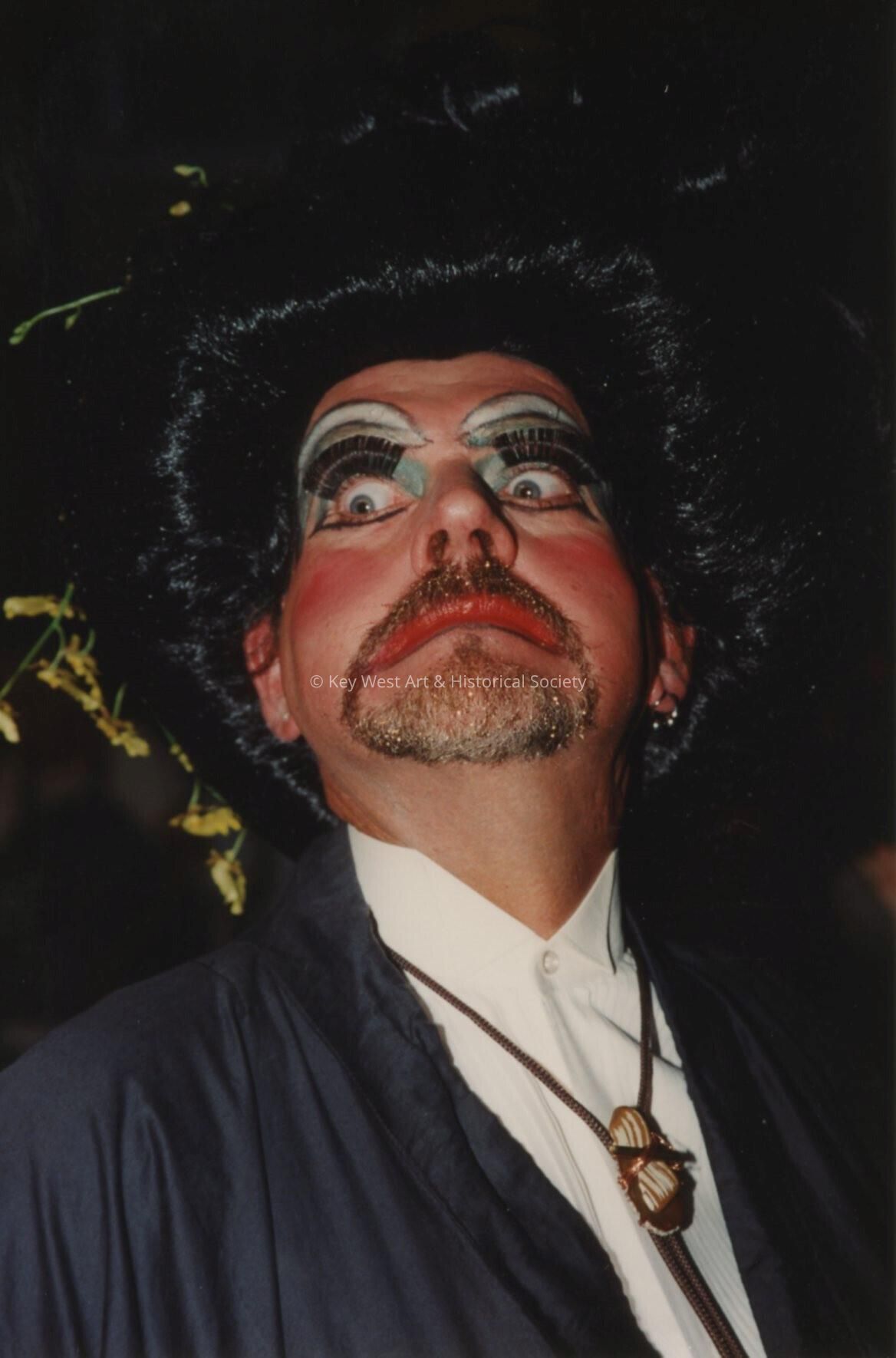 An unknown man dressed up.