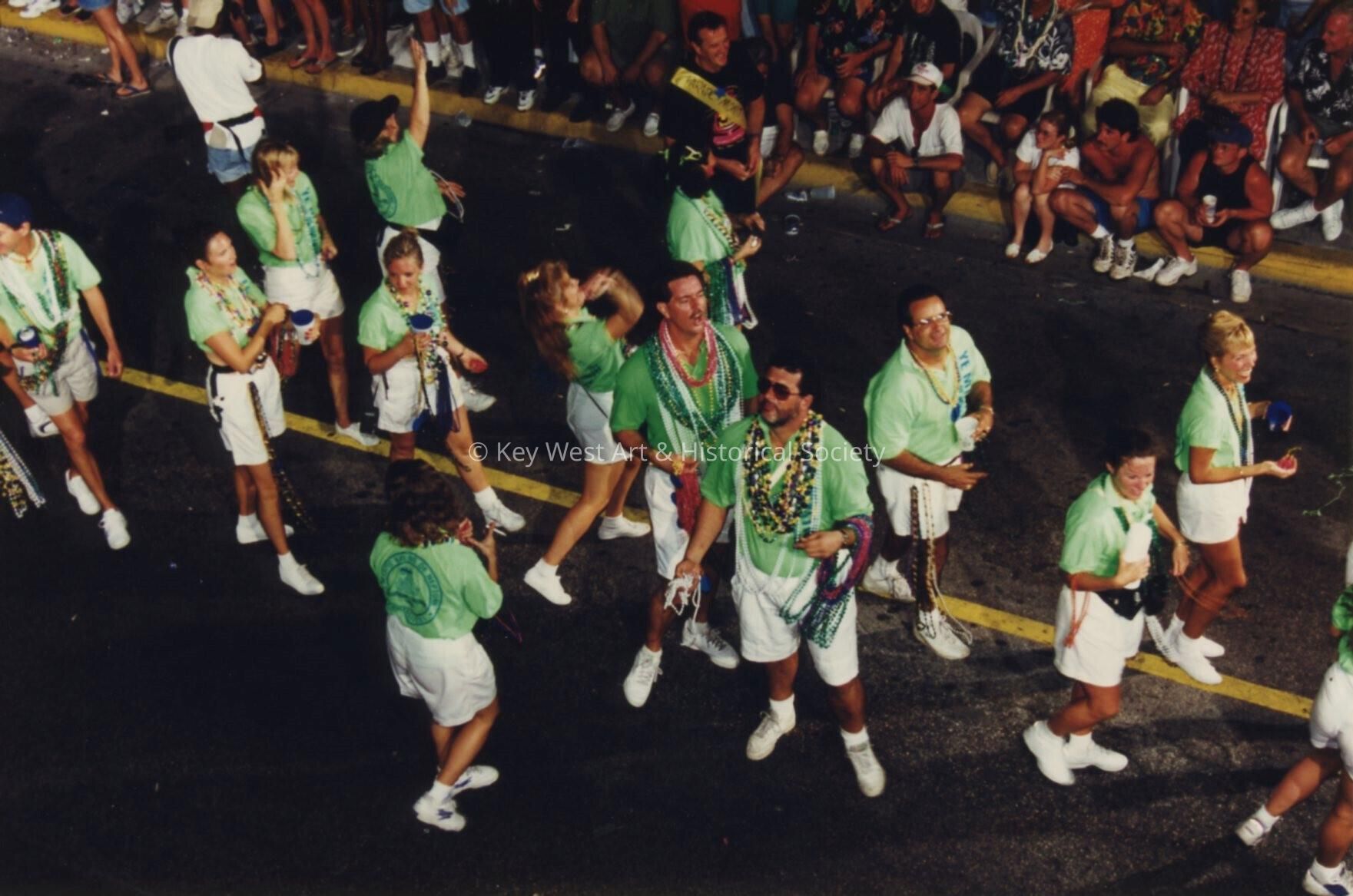 A group of unknown people in the parade.