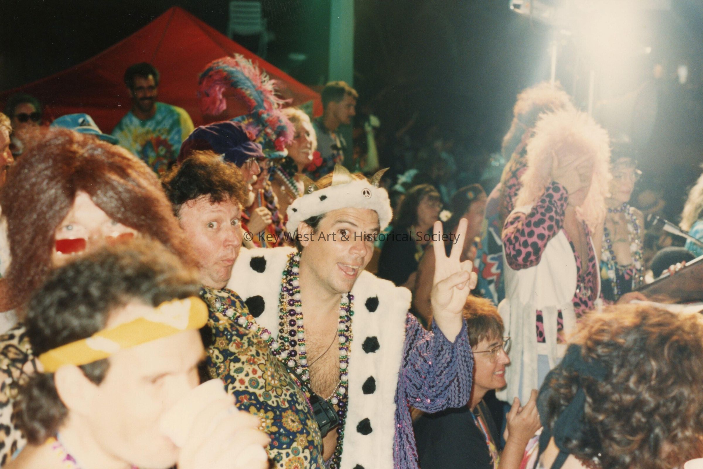 A group of unknown people dressed up.