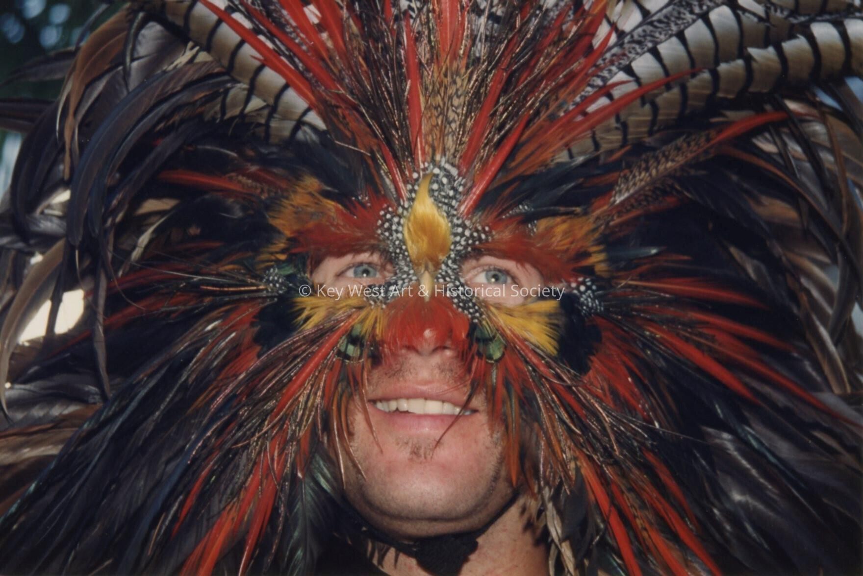 An unknown man wearing a face mask.