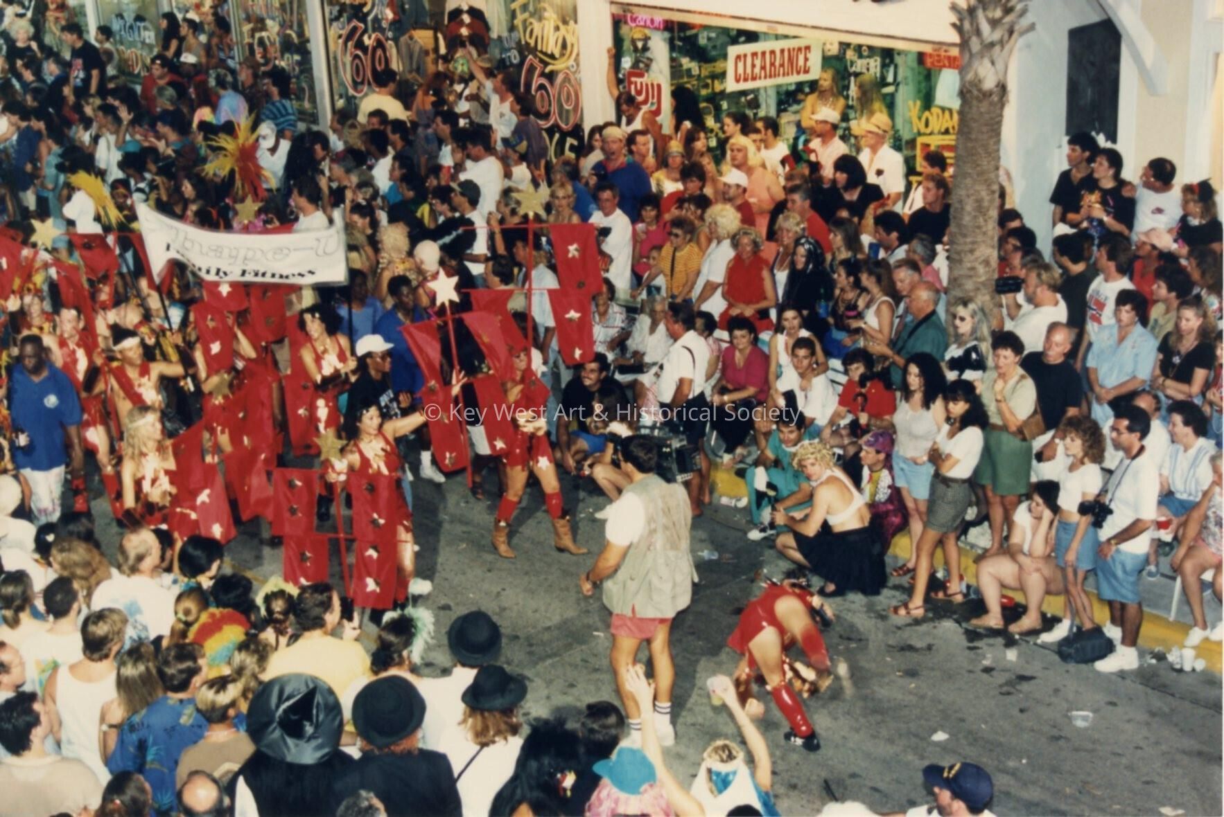 A group of people in the street during the parade.