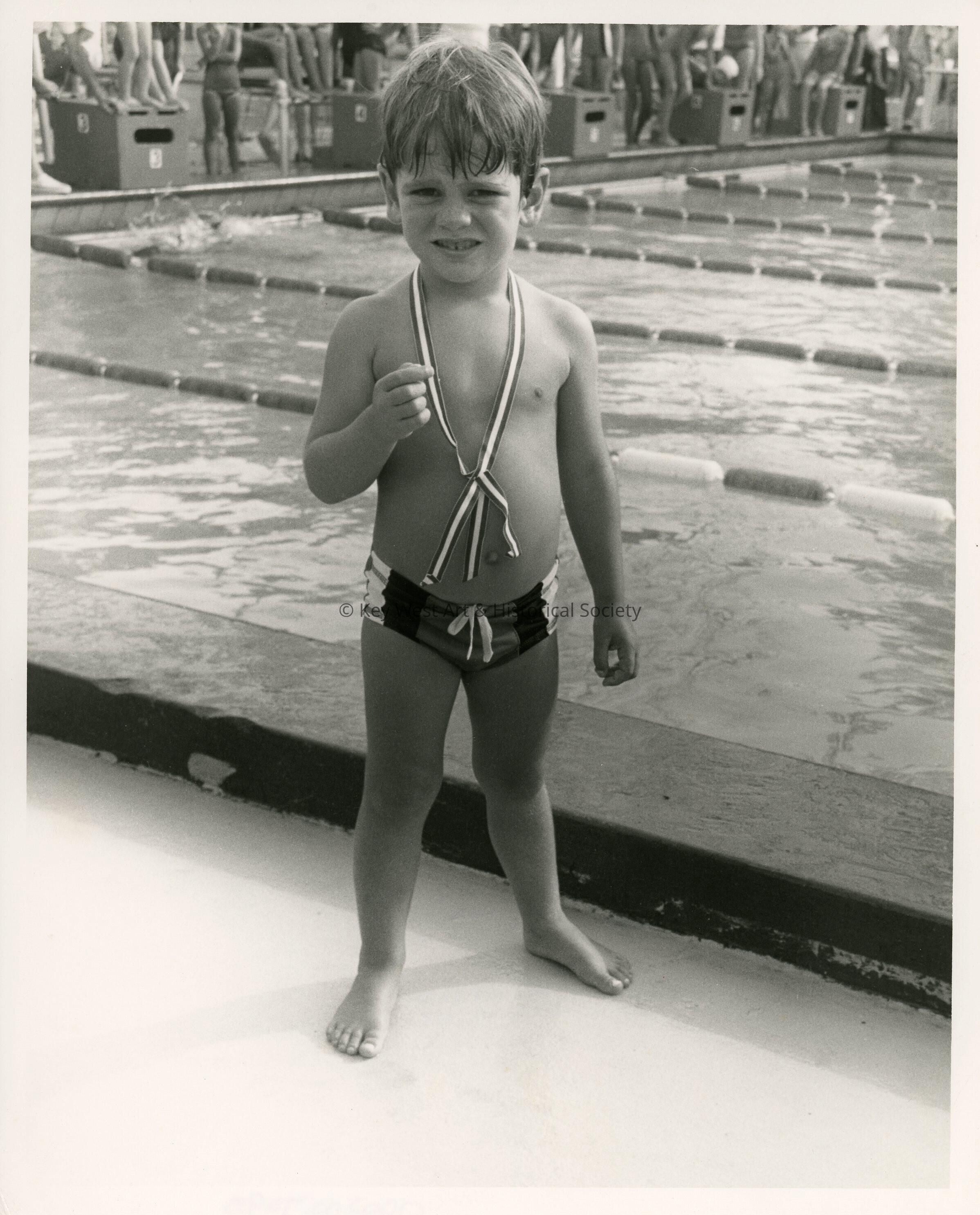 An unknown kid at a pool