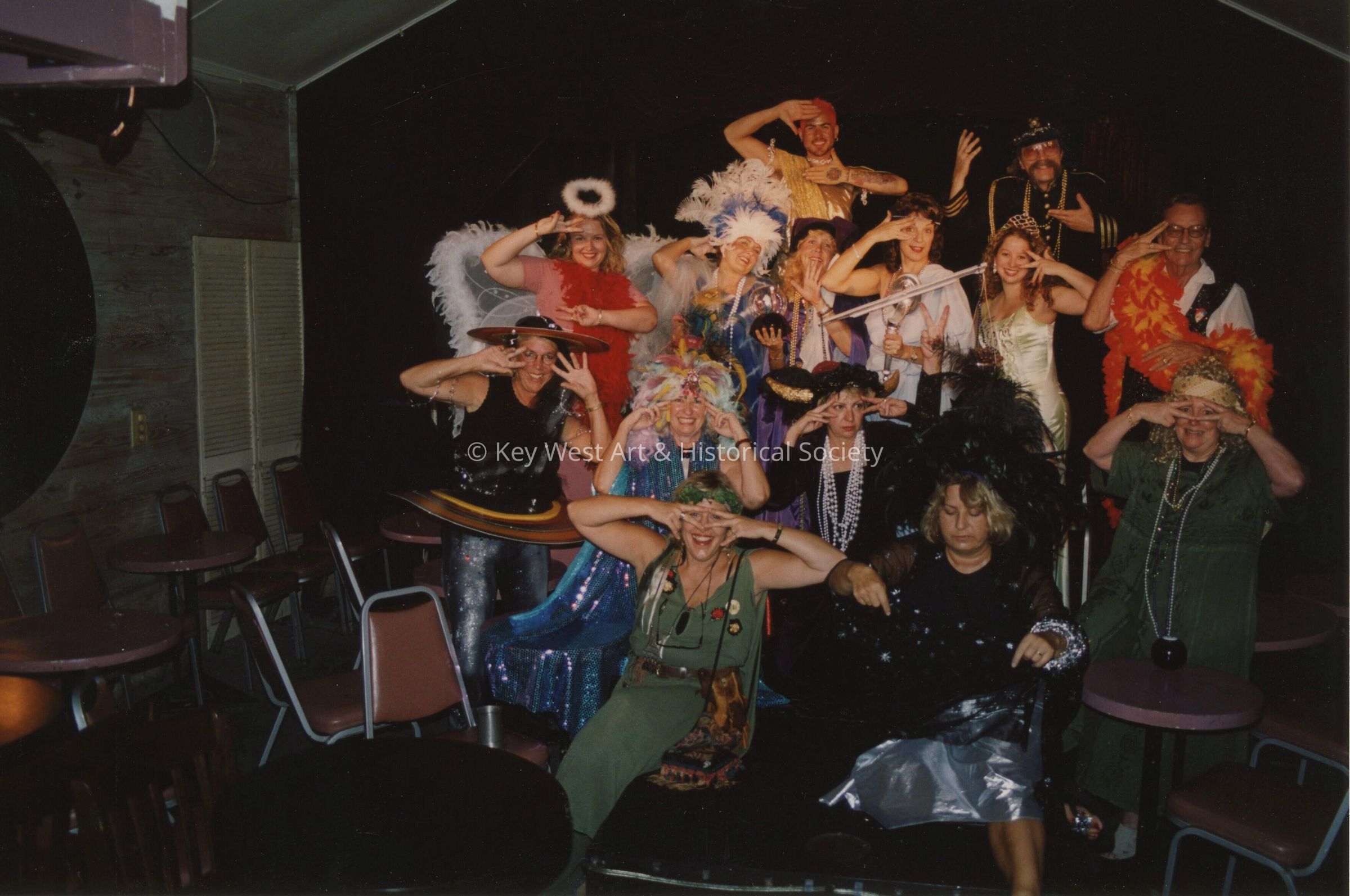 A group of unknown people dressed up.