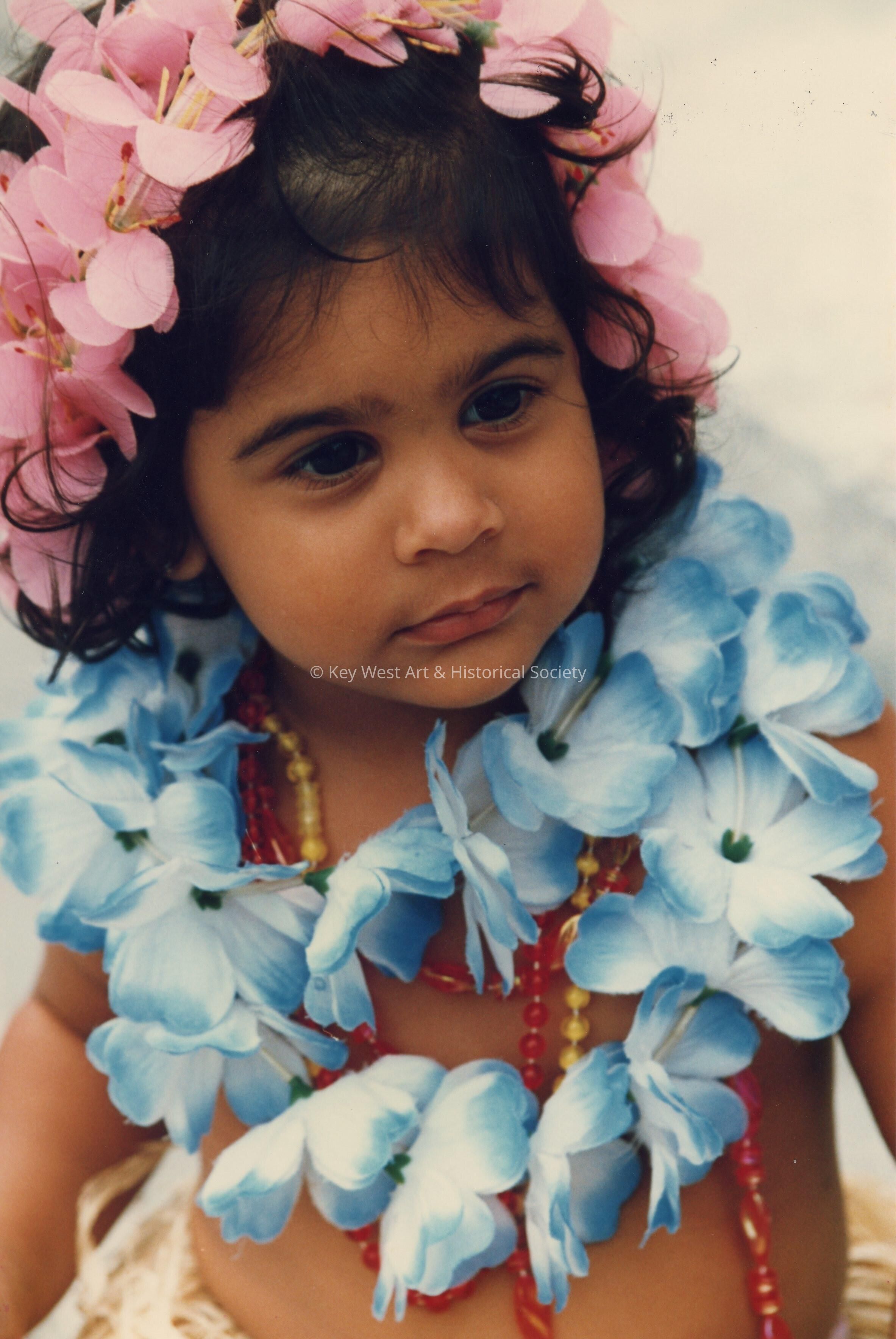 An unknown little girl dressed up.