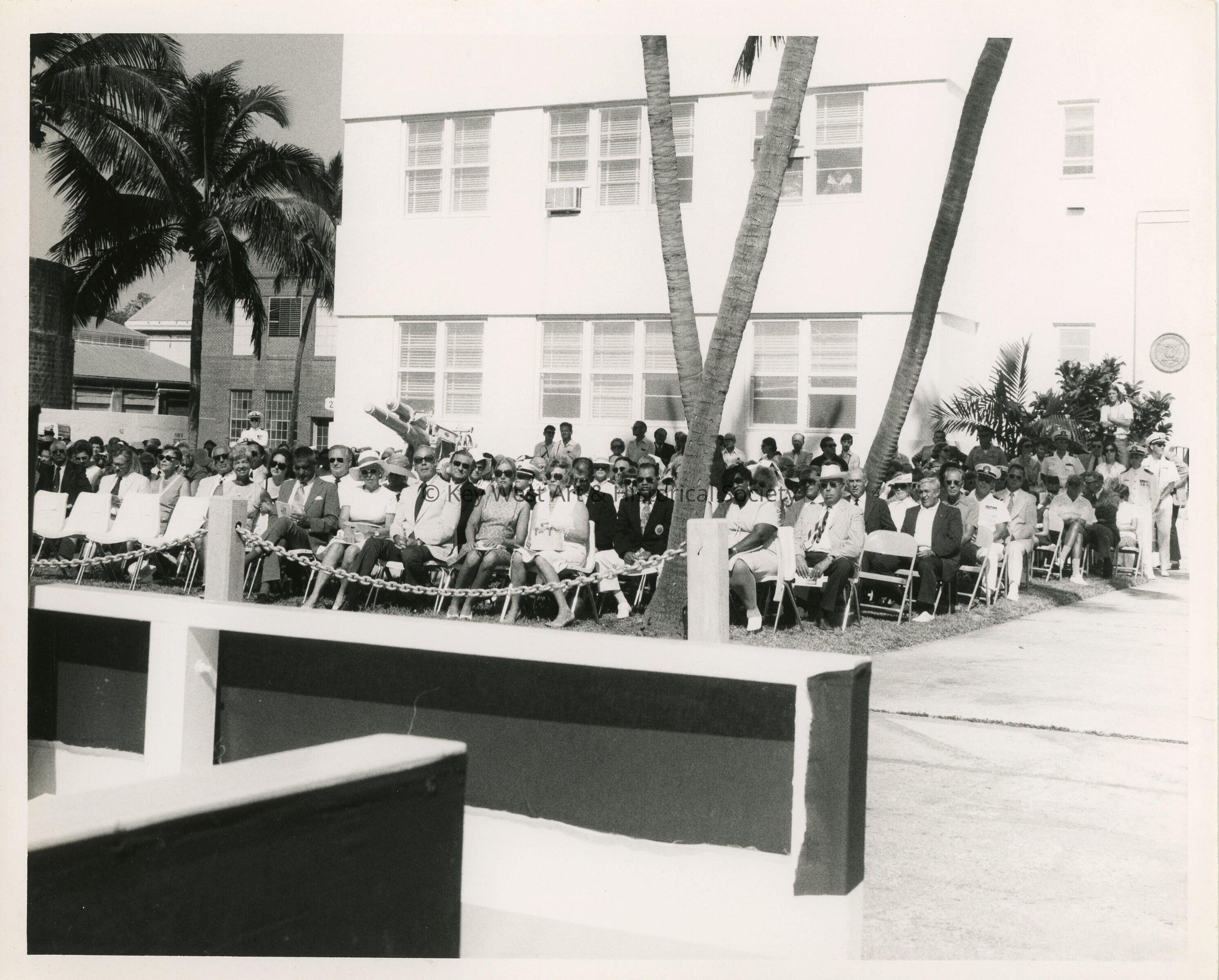 A group of people sitting at a ceremony