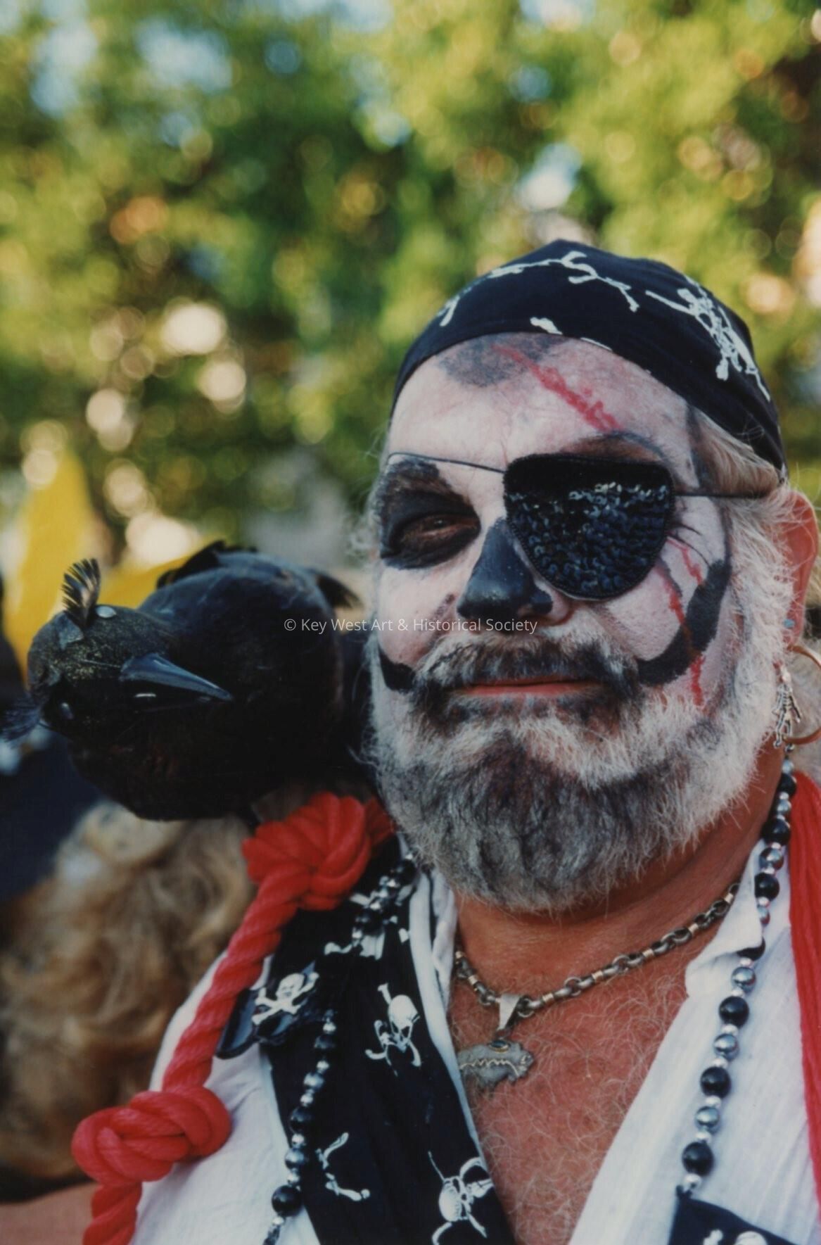 An unknown man with his face painted.