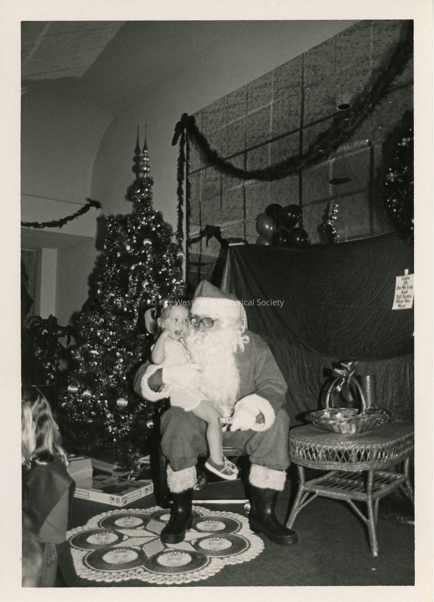 An unknown child sitting on Santa's lap