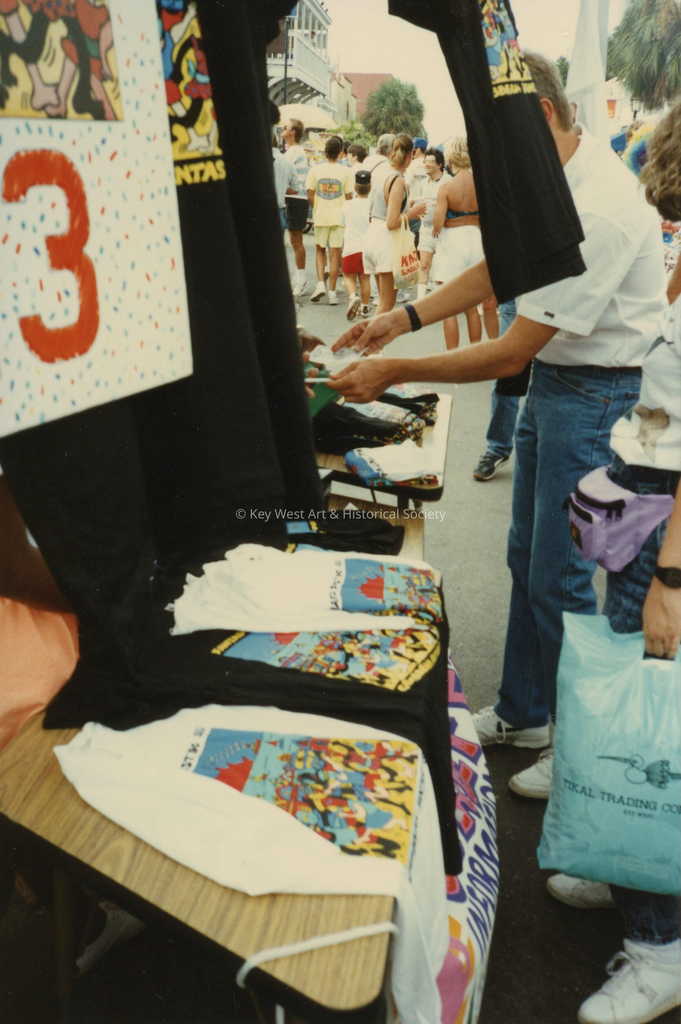 A FF street fair booth selling FF T shirts.