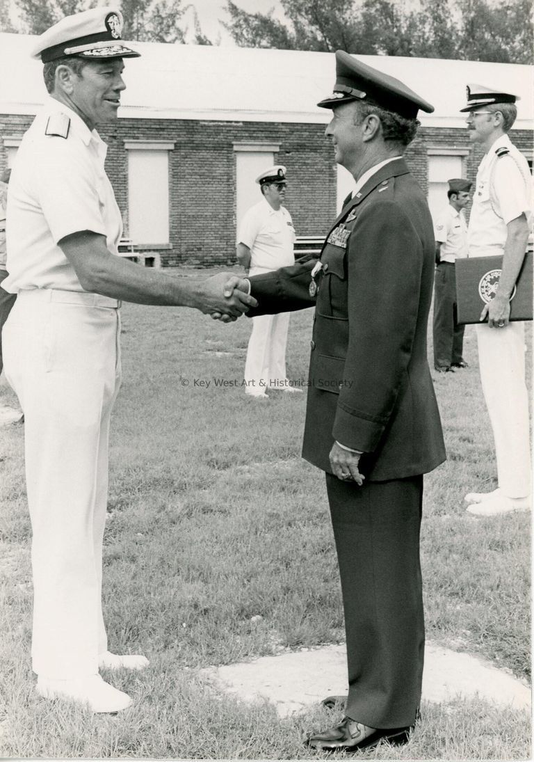 2 Men in uniform shaking hands