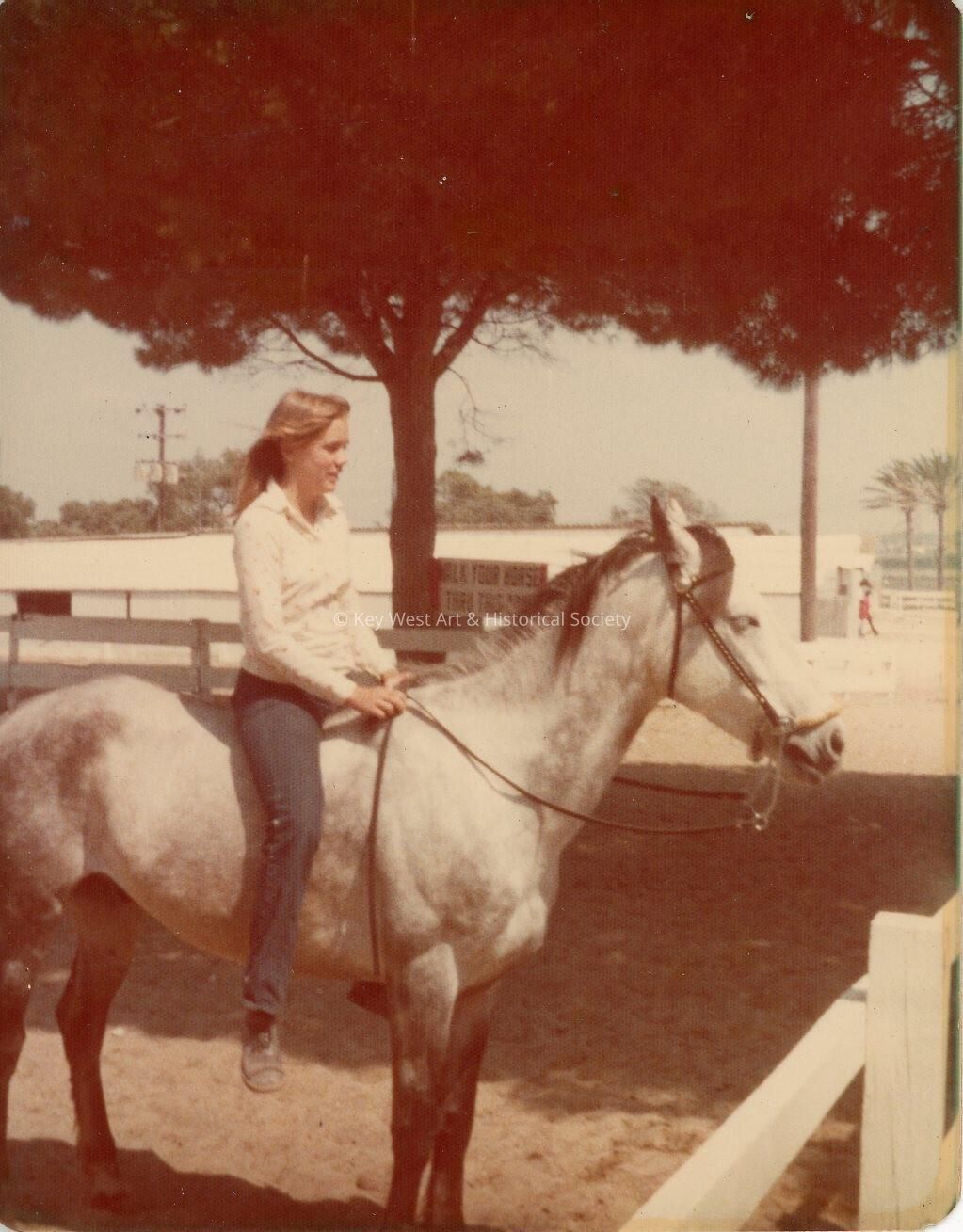 An unknown woman on a horse