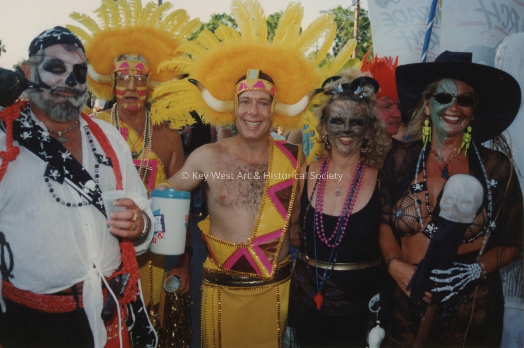 Five unknown people dressed up.