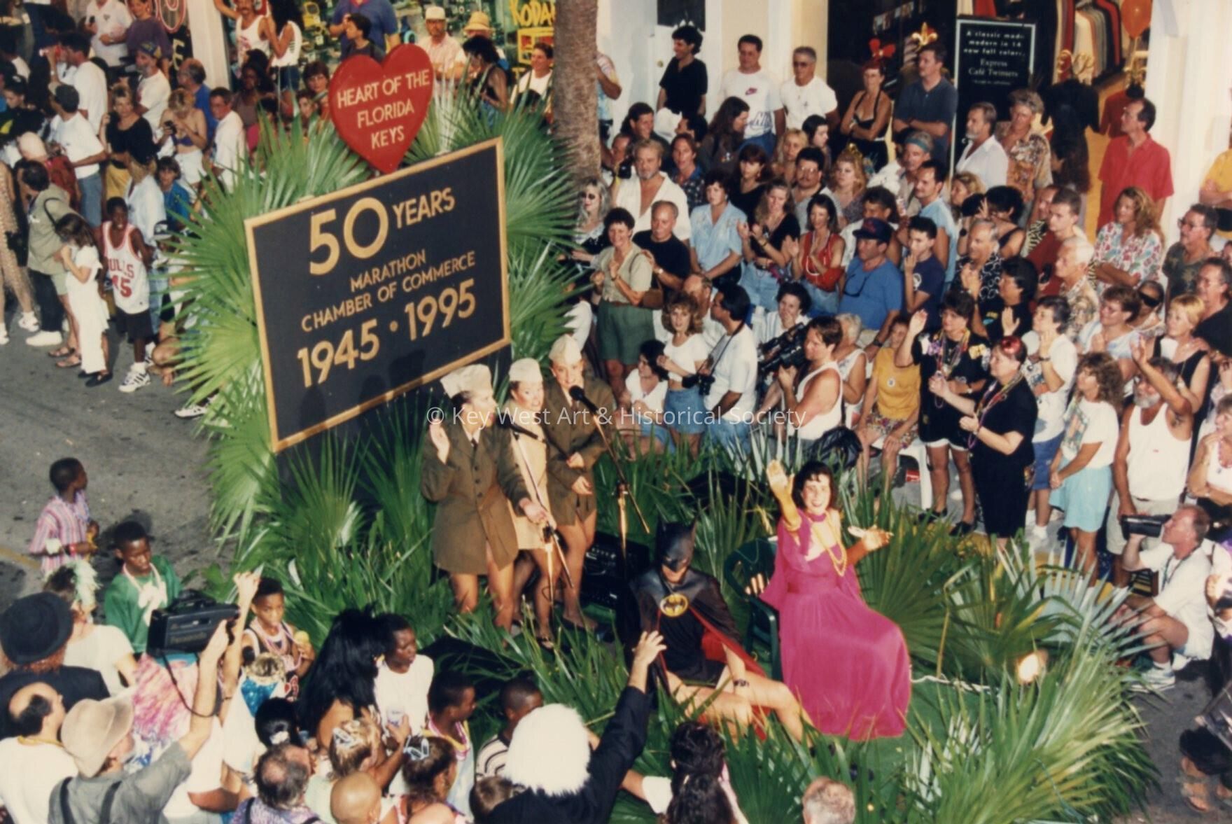 Float in the parade that reads Marathon chamber of commerce 1945-1995.