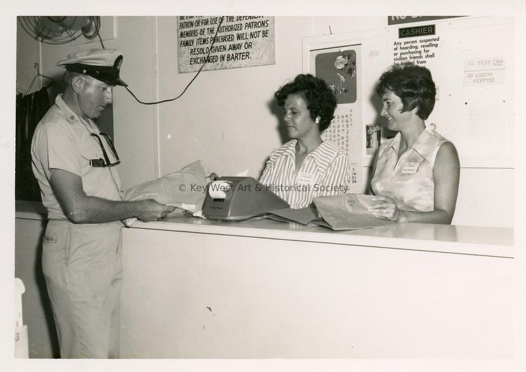 2 Unknown woman working a counter