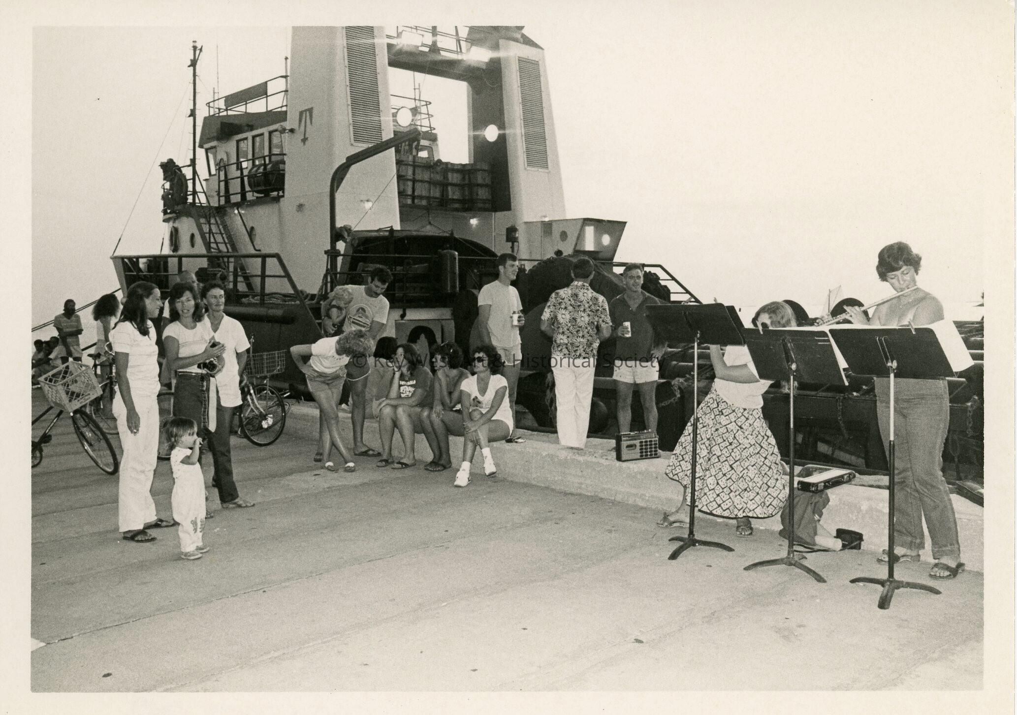 A group of people near a boat