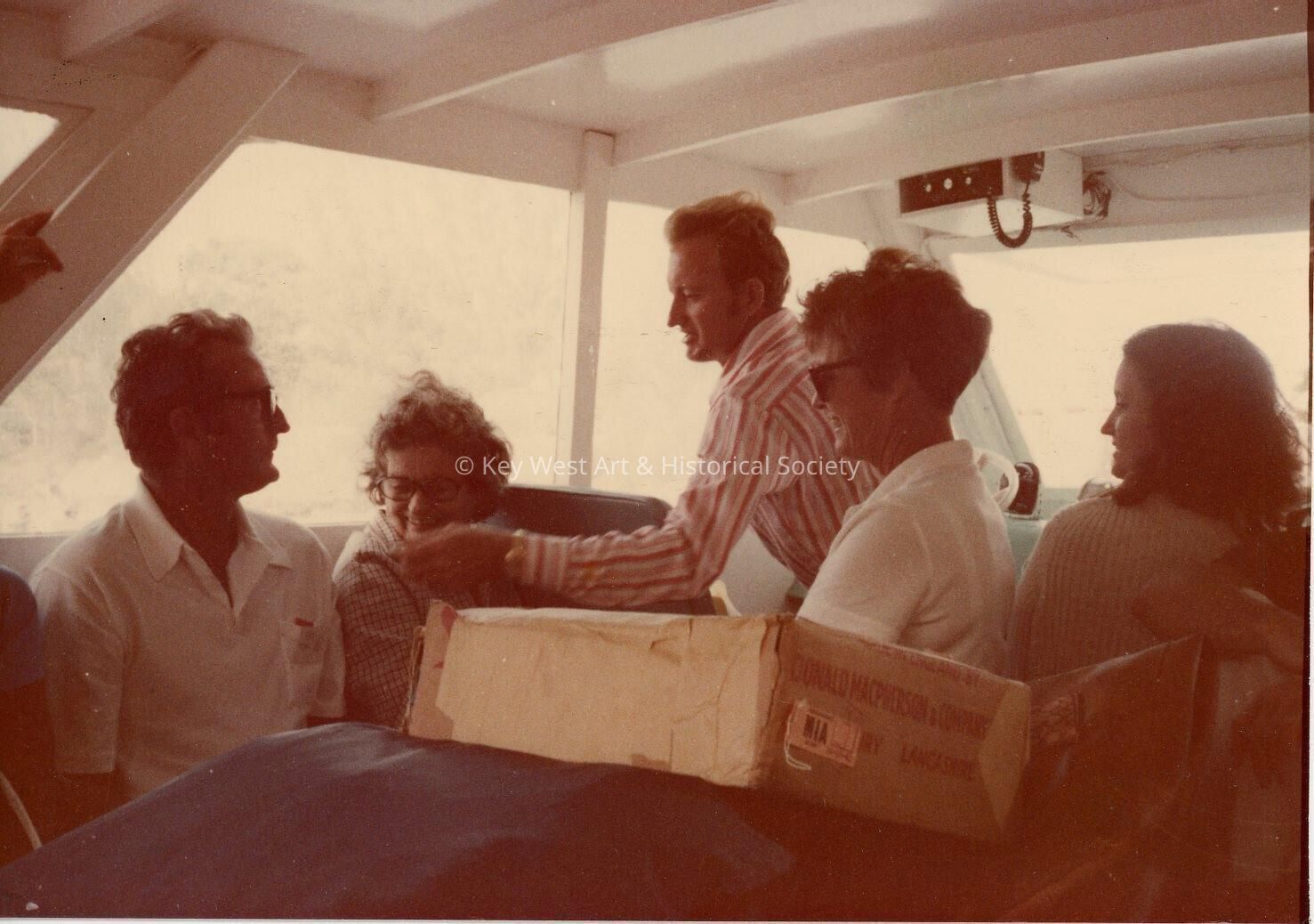 A group of people sitting on a boat