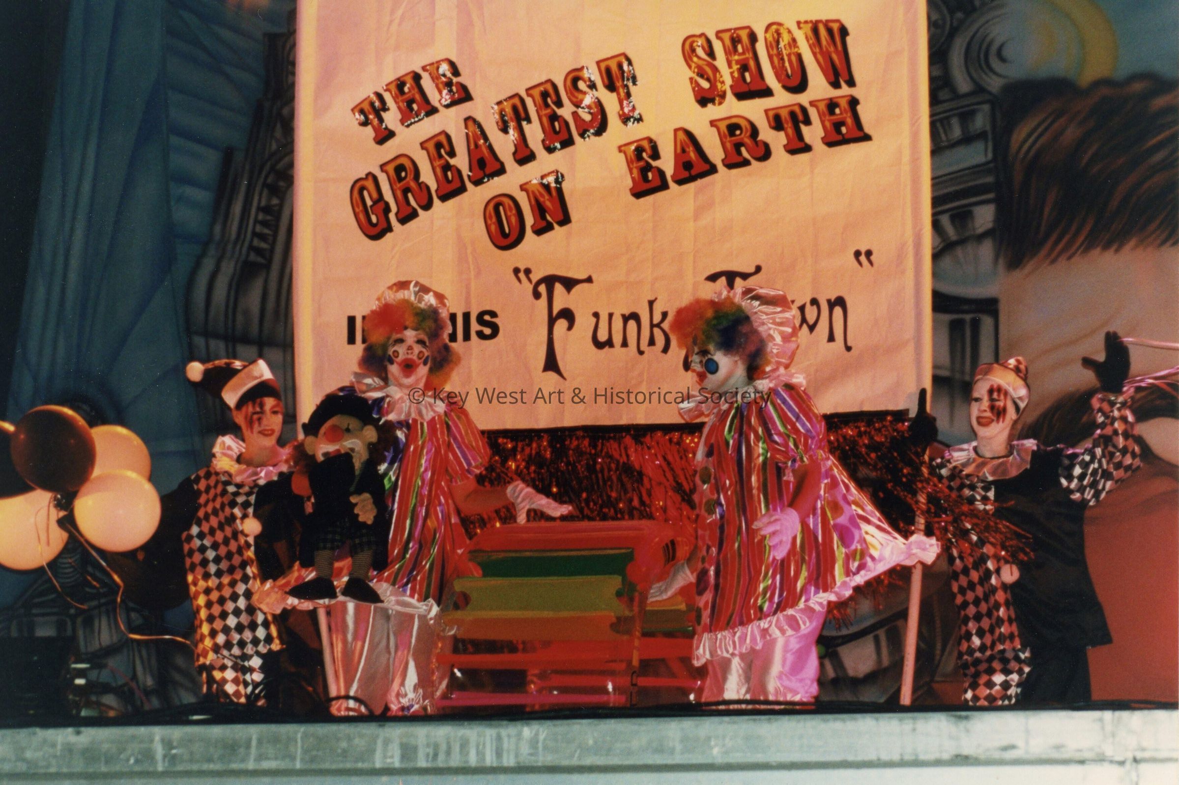 A float in the parade that reads, The greatest show on earth.