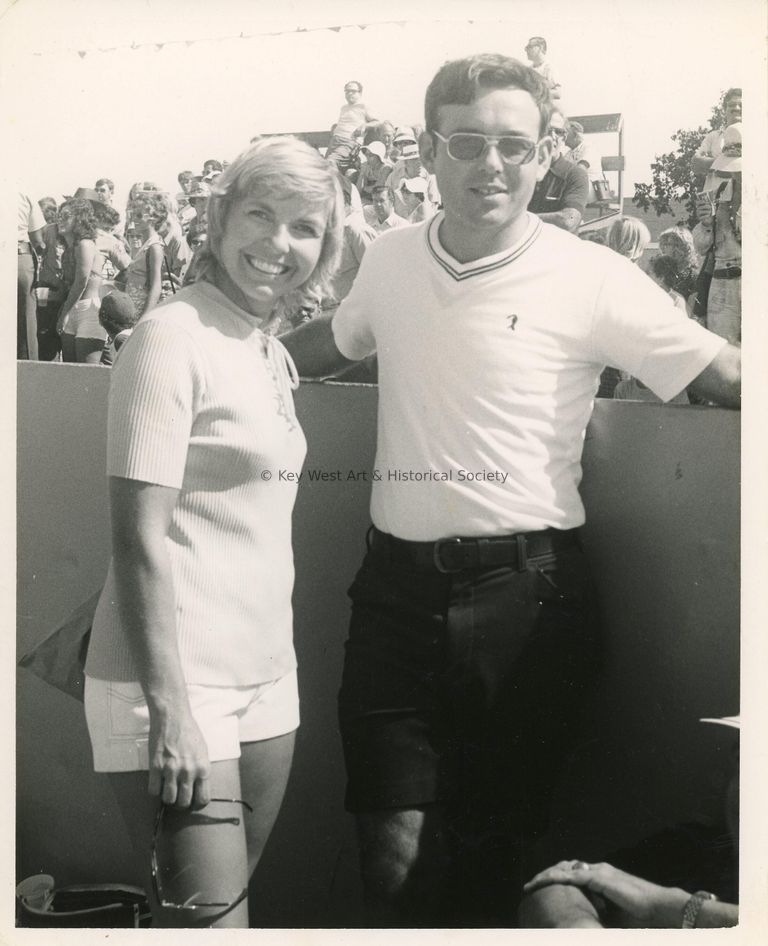 2 Unknown people standing at a game